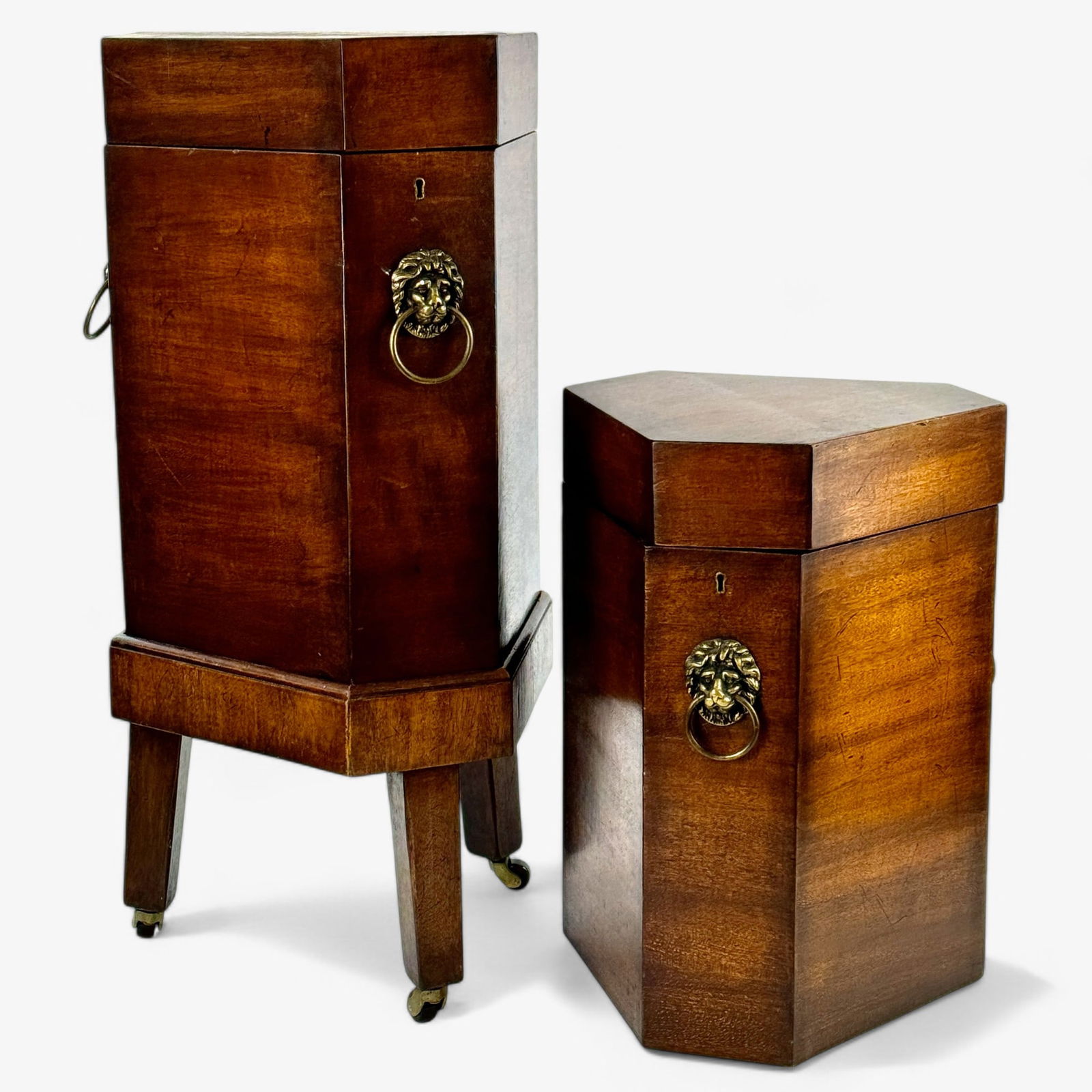 Pair of English Mahogany Wine Coolers: A pair of 19th century English mahogany wine coolers or cellarettes. Each on tripod wheeled stands. Ht. of each 28.5".