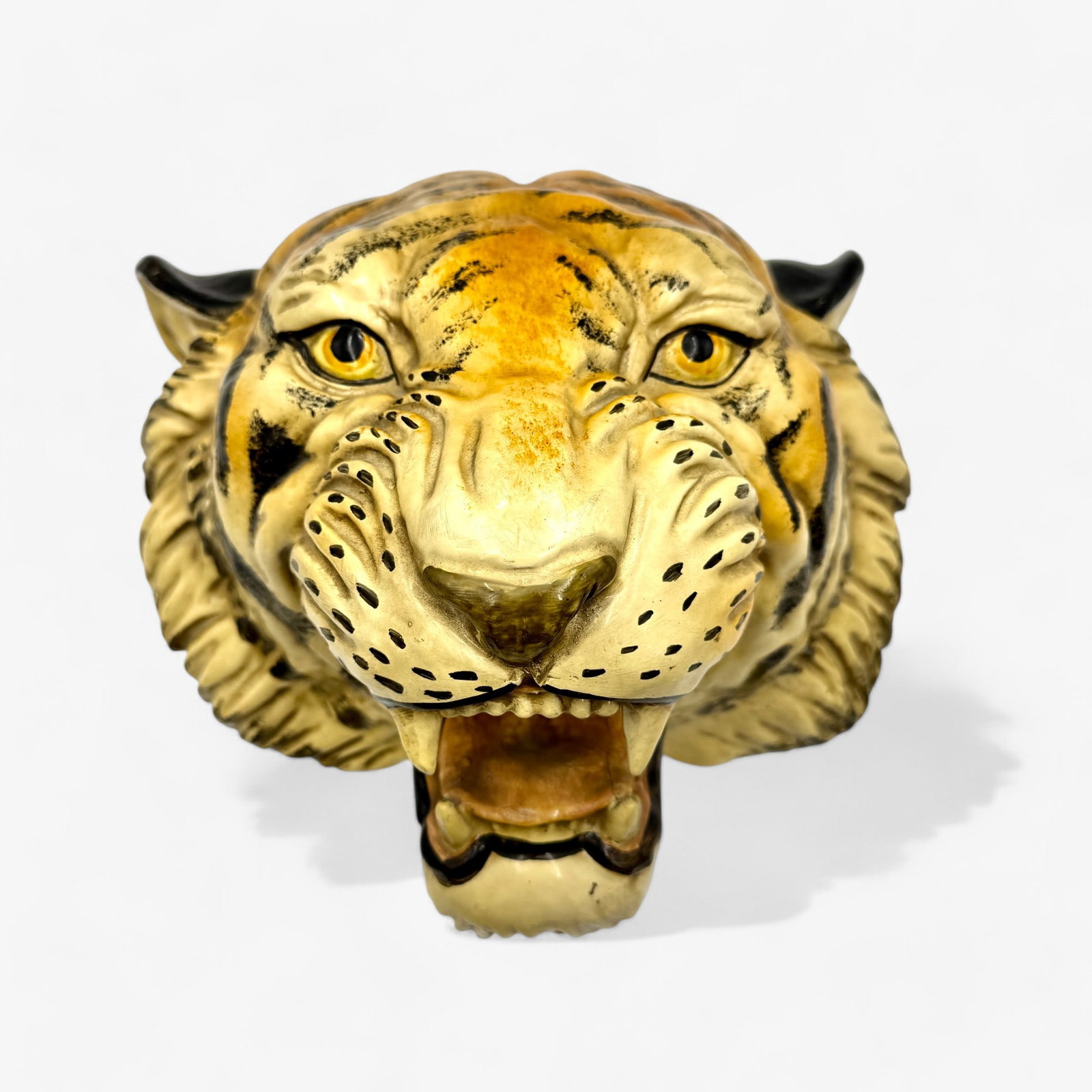 Handpainted Majolica Wall Hanging Tiger: A lifelike wall hanging Majolica / ceramic casting of a tiger, hand painted. Height: 10", depth: 10", width: 13"