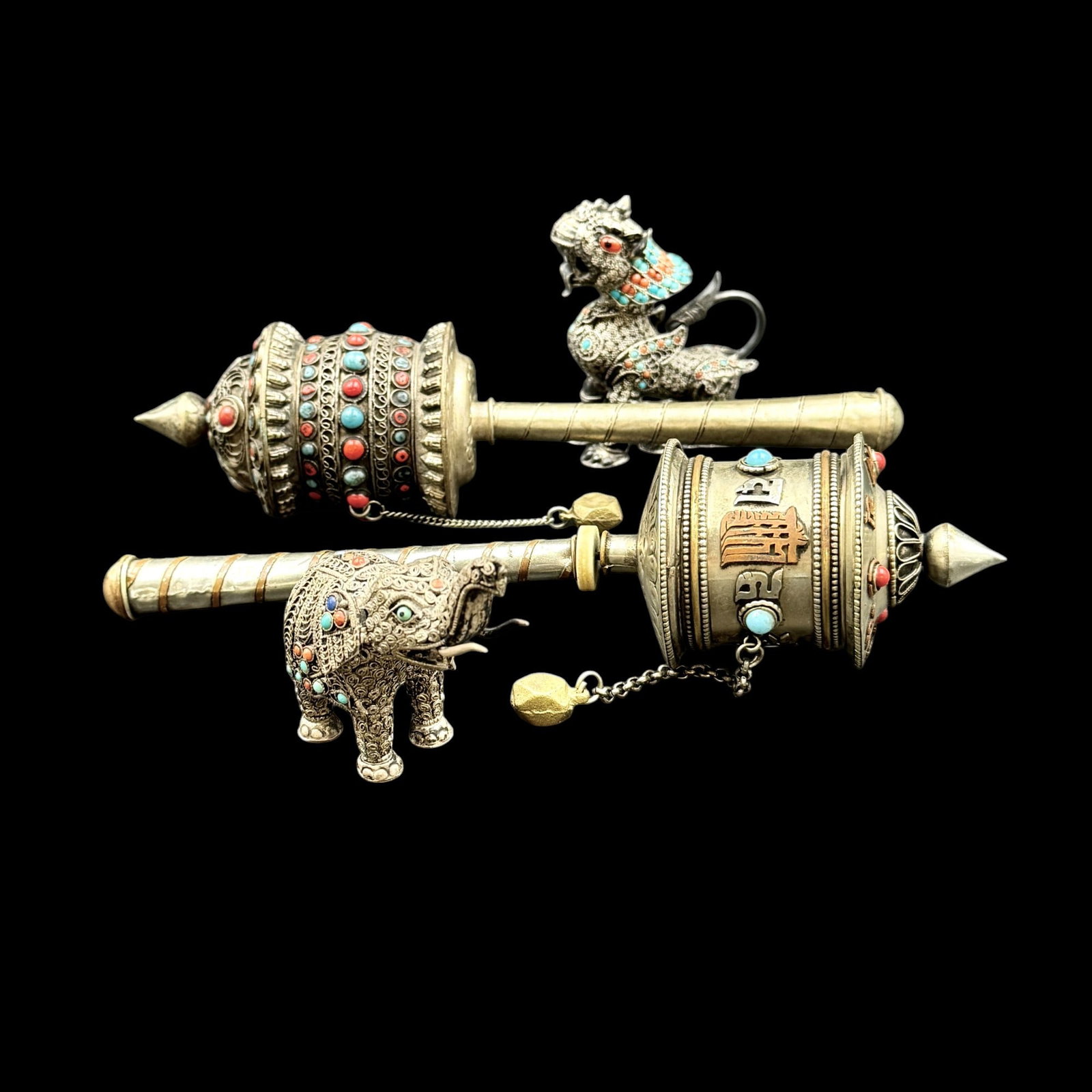 Tibetan Sterling, Stone and Metal Objects: Including two rattles one rattle head, the complete example unmarked, and a pari of animal figures each embedded with turquoise and coral, each marked "925" under feet. Ht. of tallest rattle 9".