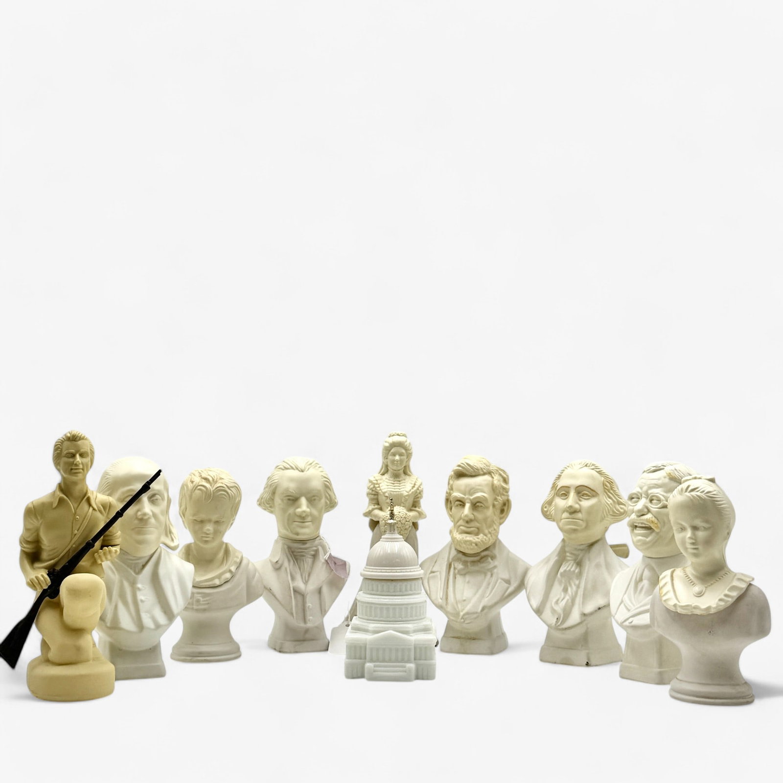 Collection of Avon Presidential and Historic Aftershave: A group of 10 white toned, Parian style busts of presidents and other political or historic after shave vessels. Tallest ht. 7.25".