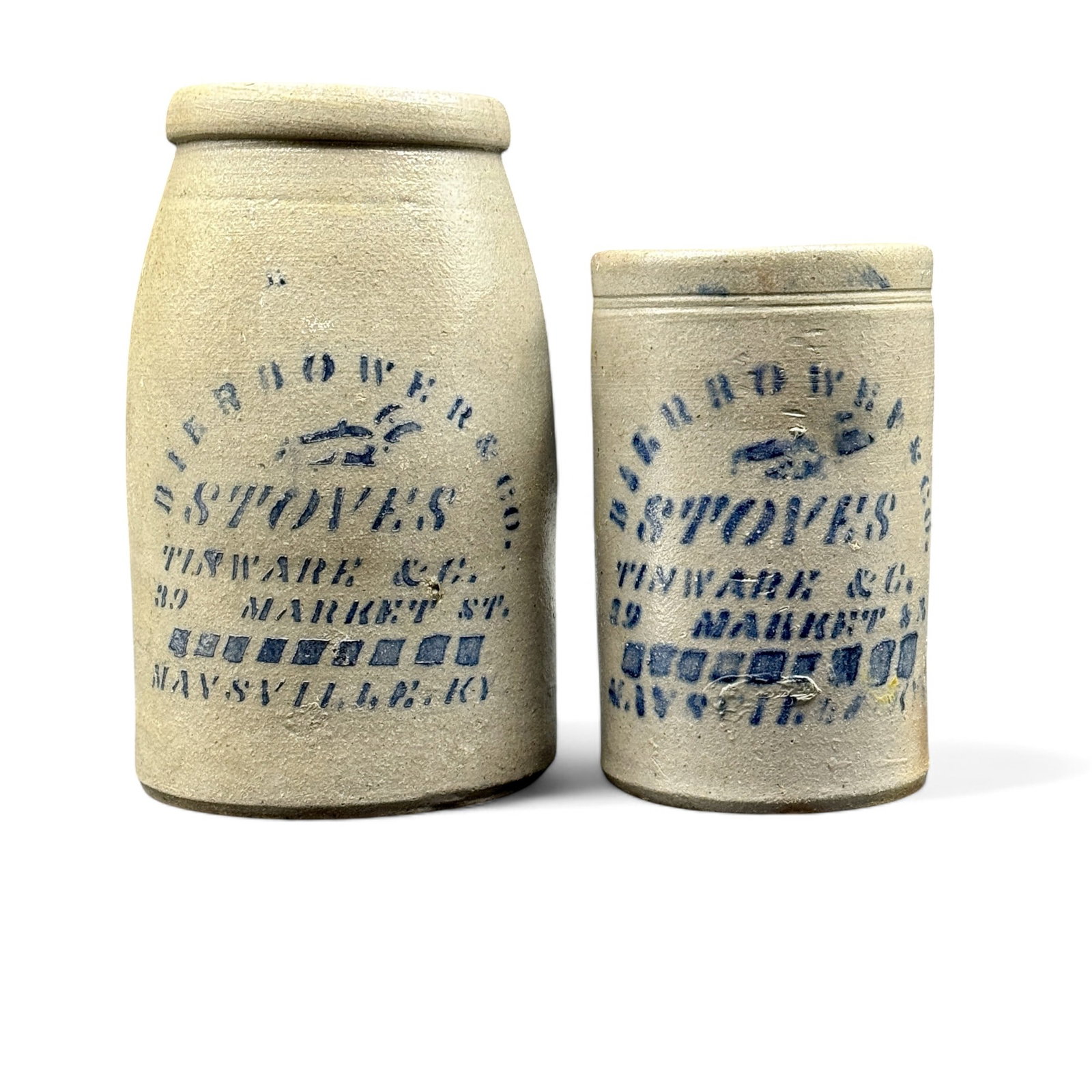 Pair of Bierbower & Co. Stonewre Jars, Maysville, KY: A pair of stoneware jars with cobalt lettering, "Stoves, Tinware & C./ 29 Market St./ Maysville KY". Ht. of tallest 8.5". The Debra and Charles Cotterill Collection of Stoneware, Maysville, KY