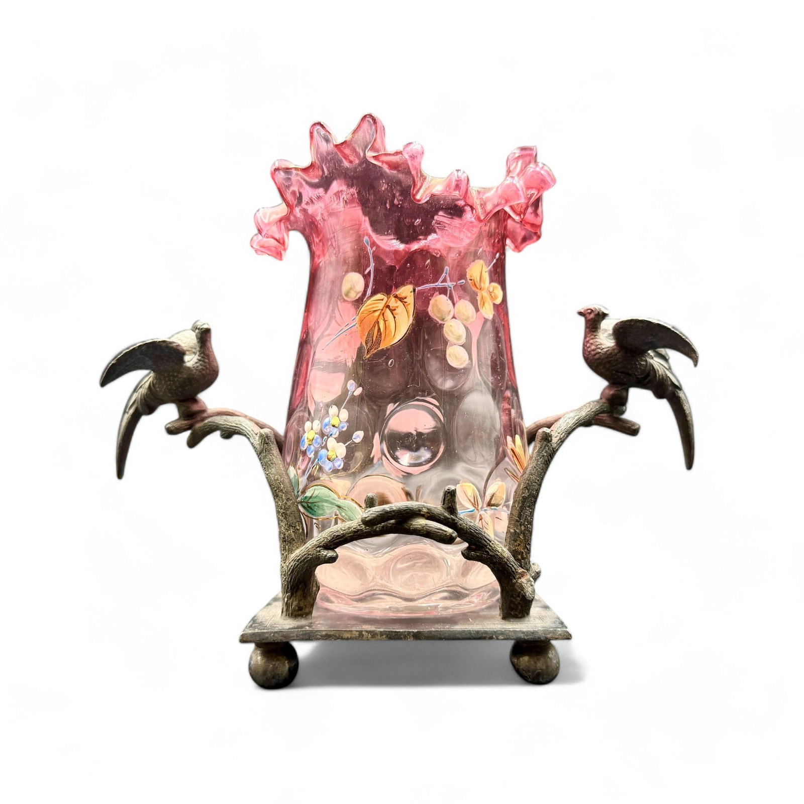 Victorian Cranberry Enameled Glass on Silverplate Base: Decorated cranberry glass celery vase, folded top, decorated with garden motifs of flowers and butterflies, sitting on a base made by Aurora Co., with ornamental birds (overall ht. on stand 6.5").