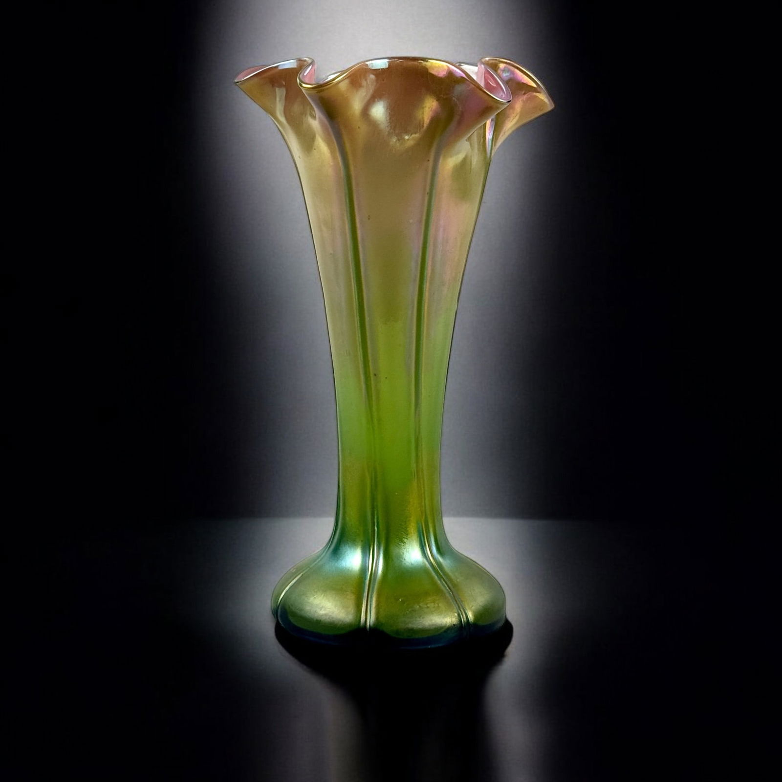 Signed Loetz Art Glass Vase: Loetz, Austria. A flaring green toned art glass vase, with pink hue to interior. Ht. 10.25".