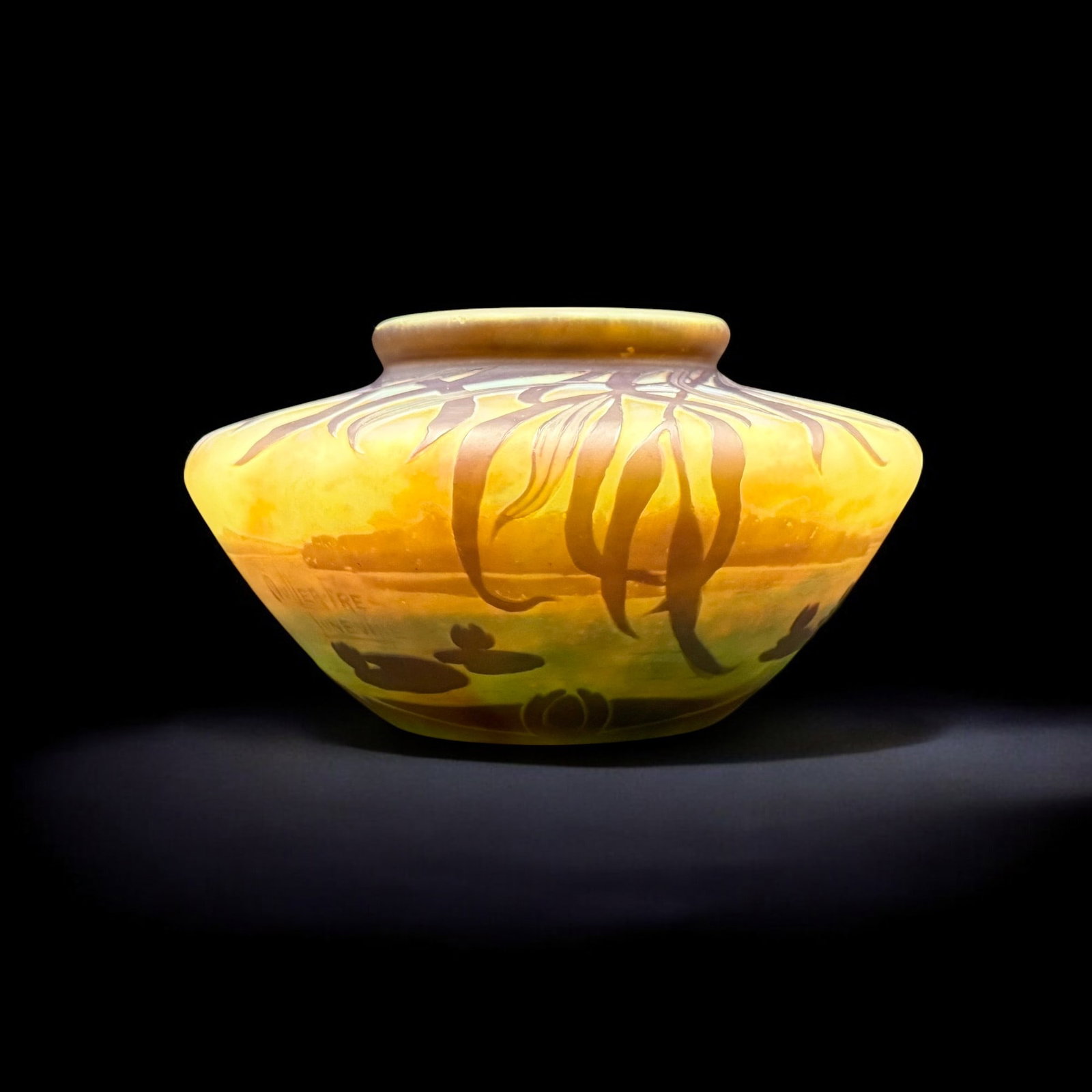 Muller Fres Luneville French Cameo Scenic Vase: Muller Fres Luneville French Cameo Co. A finely executed low vase with leaves to the rim, and a marshland scenic to the body, replete with dragonfly, lotus pads and soft horizon. Ht. 3.5", diameter 6"