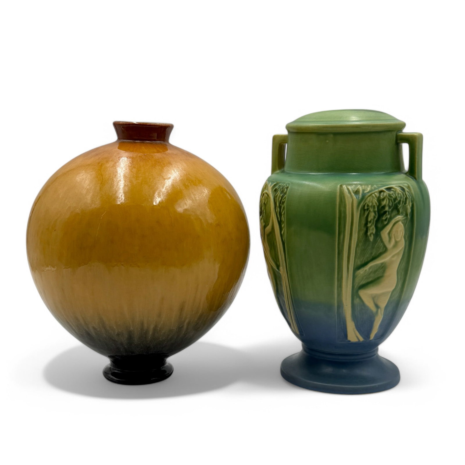Pair of Roseville Lamp Bases, Art Pottery: Two Roseville Lamp Bases. Panel Nude in blue with Roseville paper sticker, 10 1/2" ht. Glaze Effect in gold with orange crayon marks on bottom. Including R-11 in crayon and F-104 in black.
