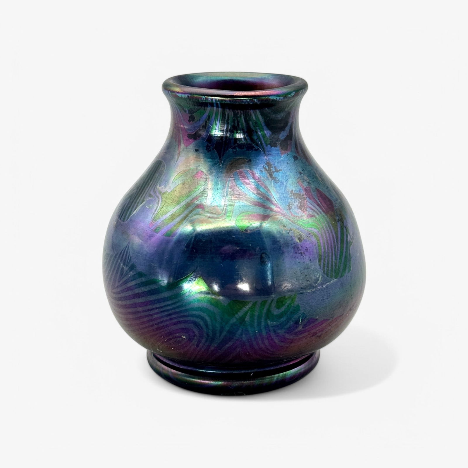 Louis Comfort Tiffany Favrile Cabinet Case: Signed L.C. Tiffany Favrile to base, shape number 3395D. Deep iridescent green and purple glaze. Height: 3". Property of an Illinois Collector.