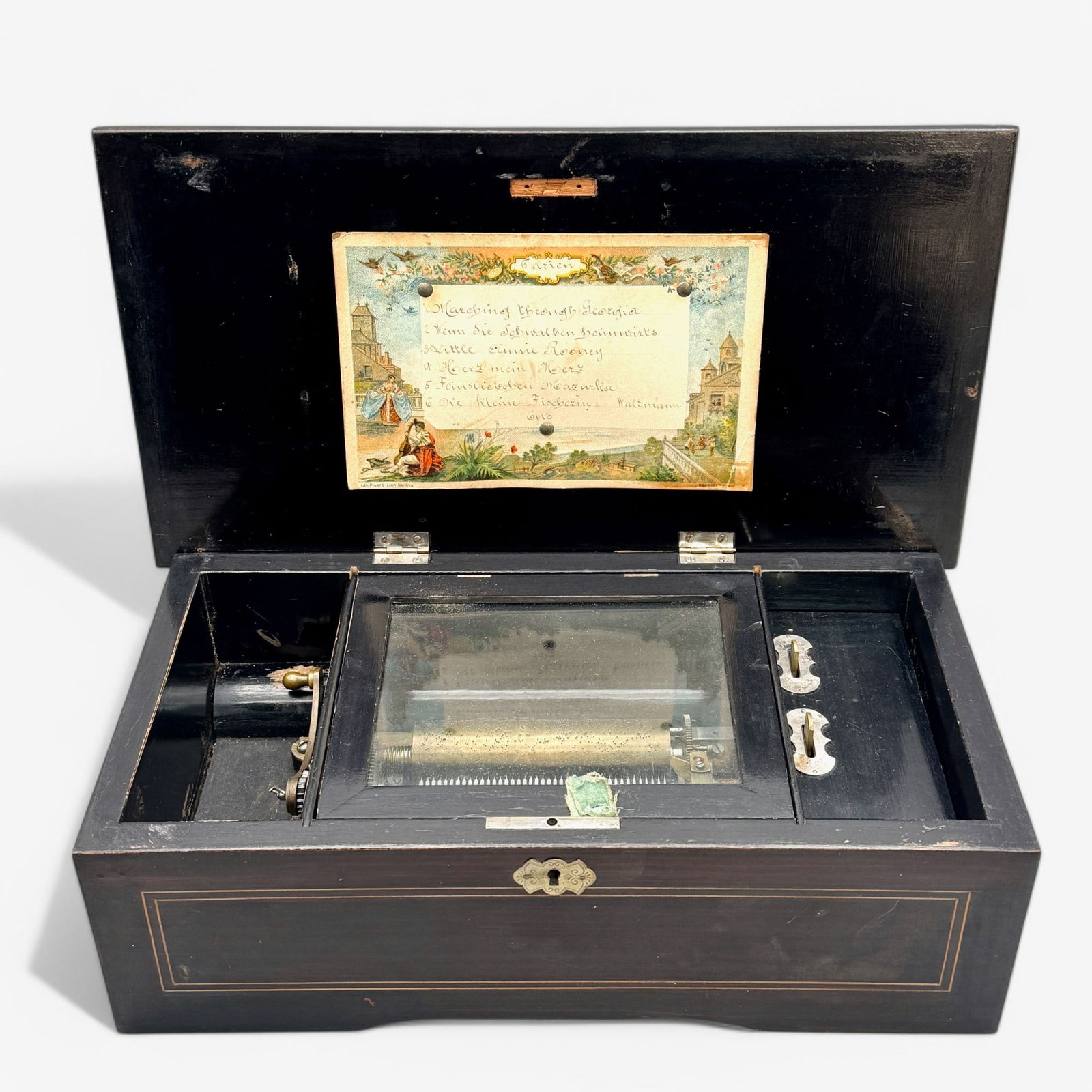 Swiss Inlaid Music Box: Marked Switzerland to bottom, with one scroll. Inlay is intact. 5" ht. x 15" wd. x 8" dp.