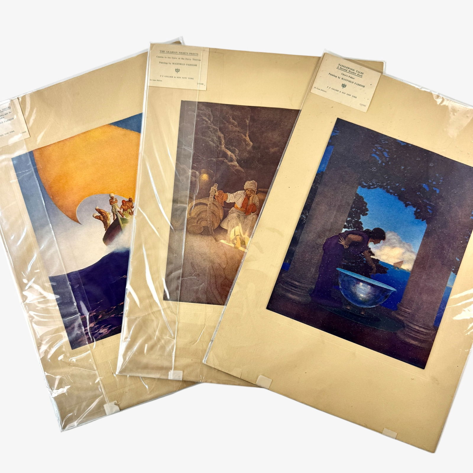 Three Collier Maxfield Parrish Prints: Each with Collier & Sons publisher label, unframed and with three Maxfield Parrish subjects. Each 18" x 13" (backing size).