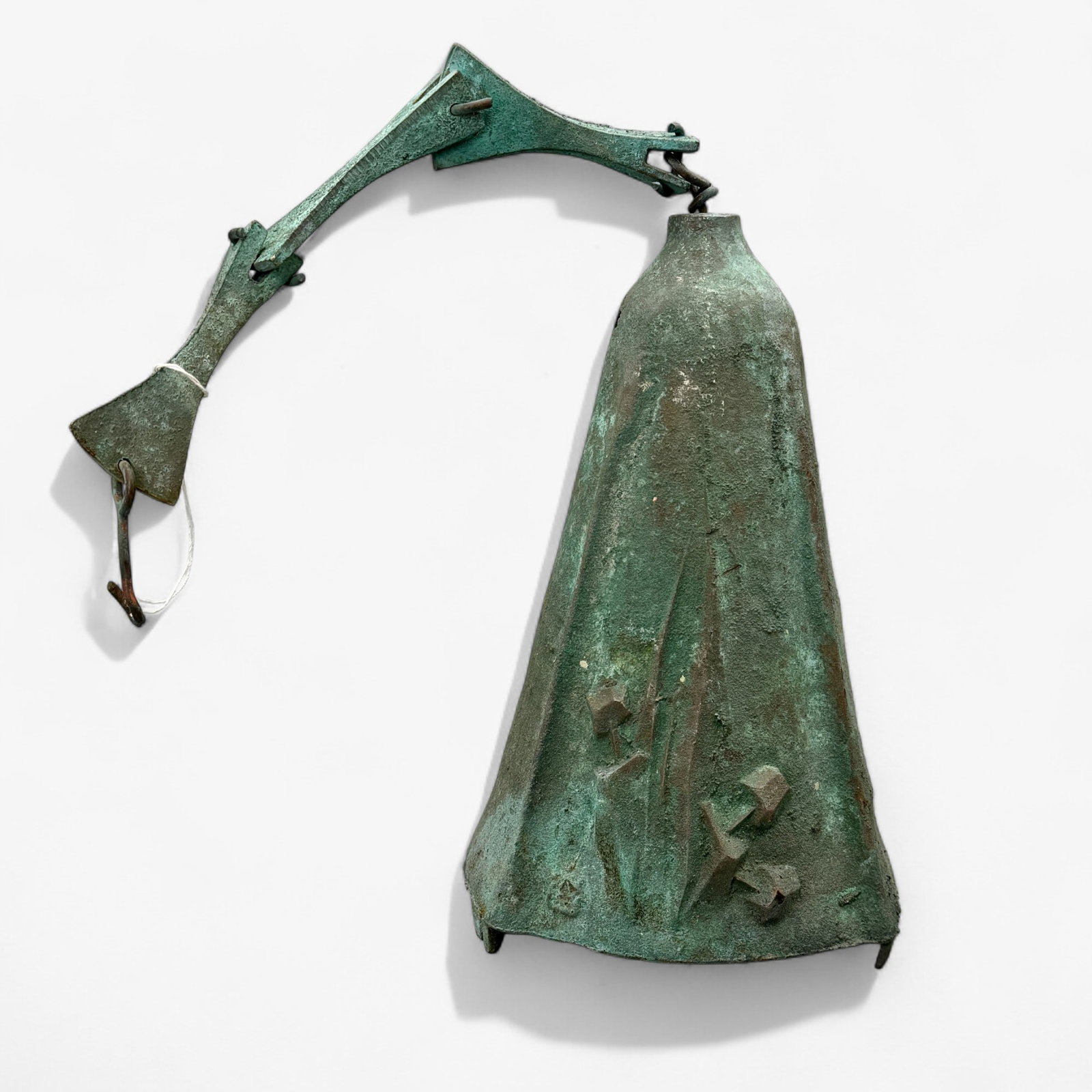 Arcosanti Paolo Soleri Brutalist Iron Bell: Early-Mid 20th century, a heavily oxidized and weathered bell in vertigree patina, in a Brutalist style, with a three piece cast hanging device. Ht. 10" (bell only).