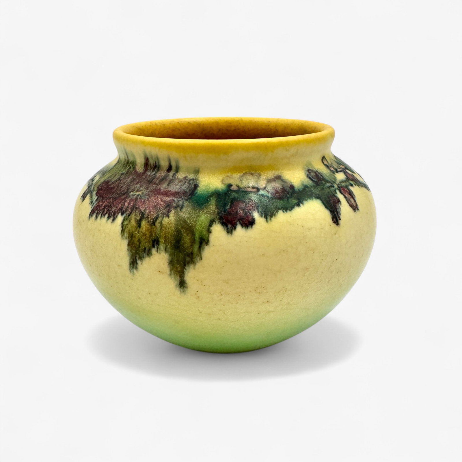 Rookwood Pottery: Elizabeth Lincoln: Rookwood decorated matte vase by Lincoln with band of florals in the round to the upper third. Shape number 1110. 1925. 4 3/8" height.