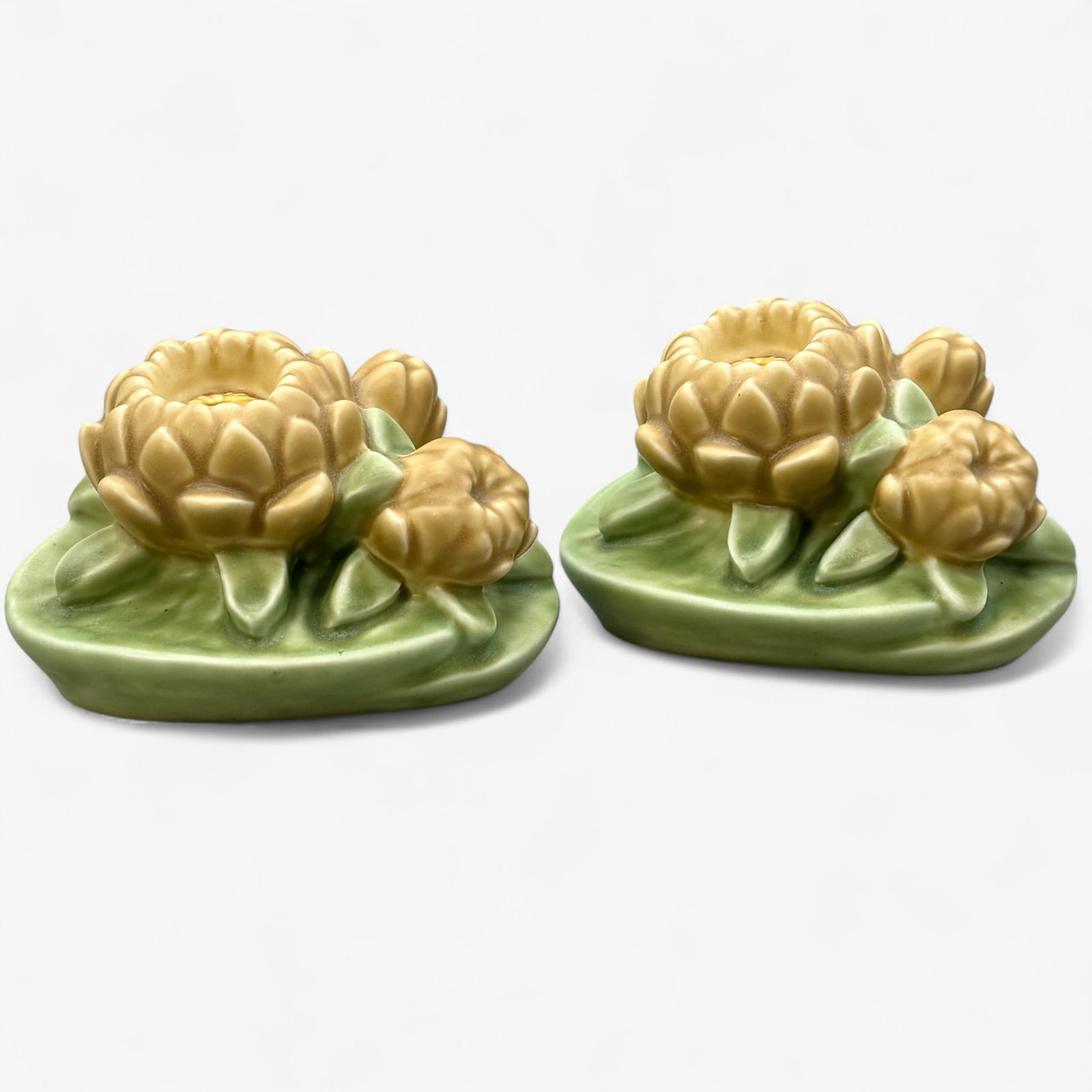 Rookwood Pottery: Polychrome Lotus Bookends: Rookwood Pottery polychrome decorated lotus bookends in mat glaze. 1946. Shape 2836. Each 3.5" ht.