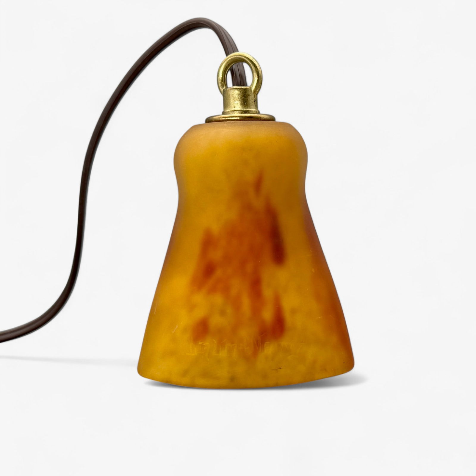 Daum Nancy Art Glass Pendant: Glass pendant with brass fittings, contemporary wiring. Etched "Daum Nancy" into side of shade. Measures 3.75" ht.