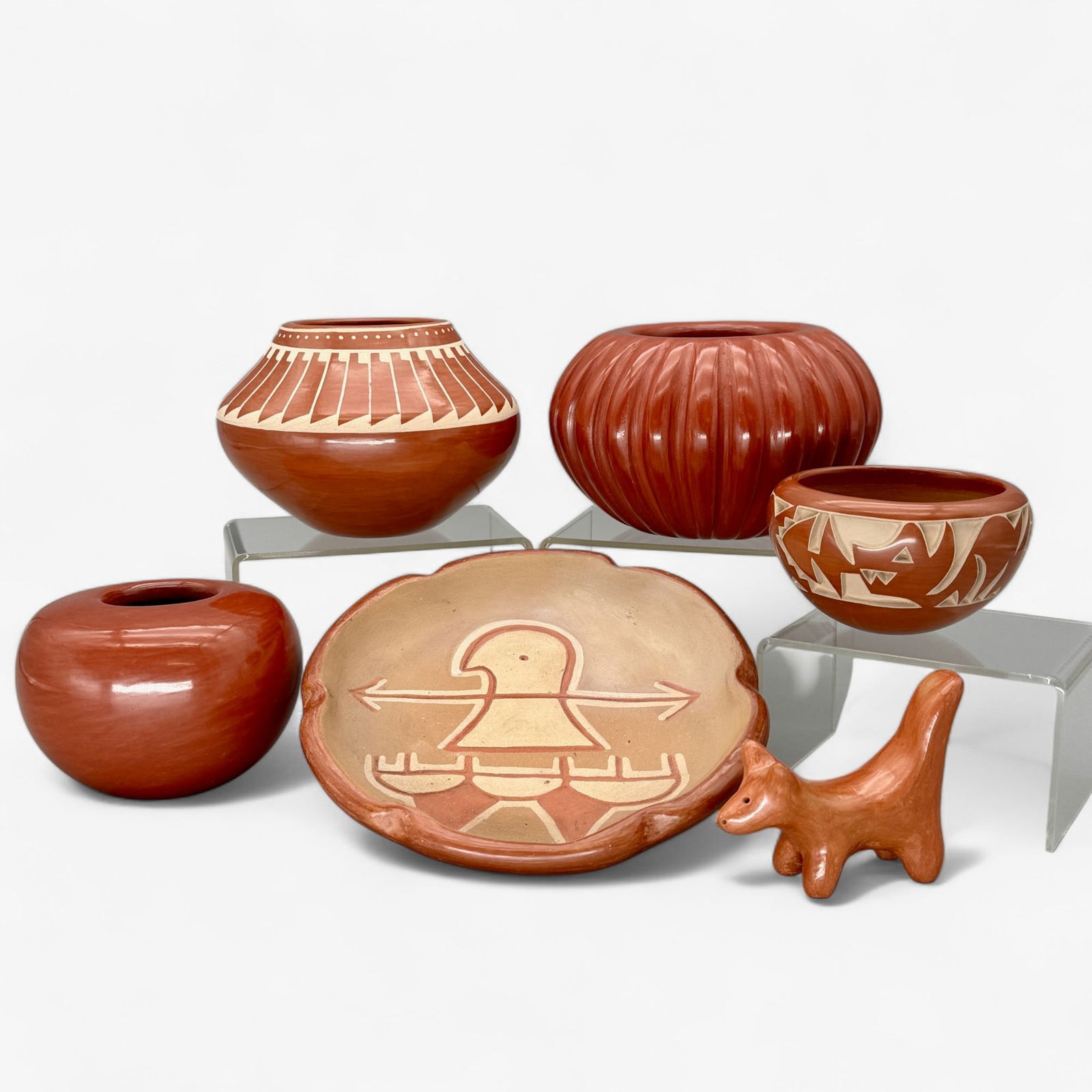 Fine Group of Native American Redware: A group of 6 pieces of redware, including a small carved bowl by Marie Suazo, Santa Clara, another bowl by Kathy Gutierrez, San Ildefonso, a lobed bowl, signed, a small vase by Sophie Cata, a decorate