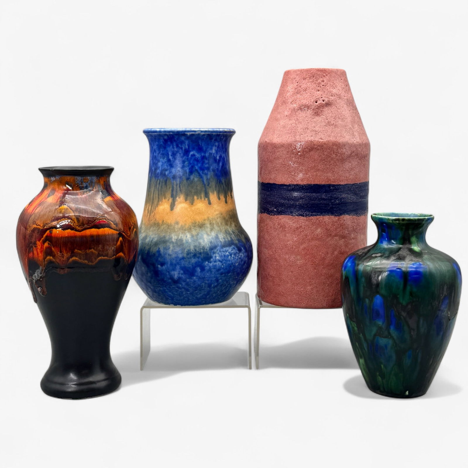 Group of Four Art Pottery Vases: Examples include one Raymor, Italy vase, one piece of drip-glaze Astra-ware, one Ruskin drip-glaze vase and one Royal Haeger vase. Tallest height: 10.75"