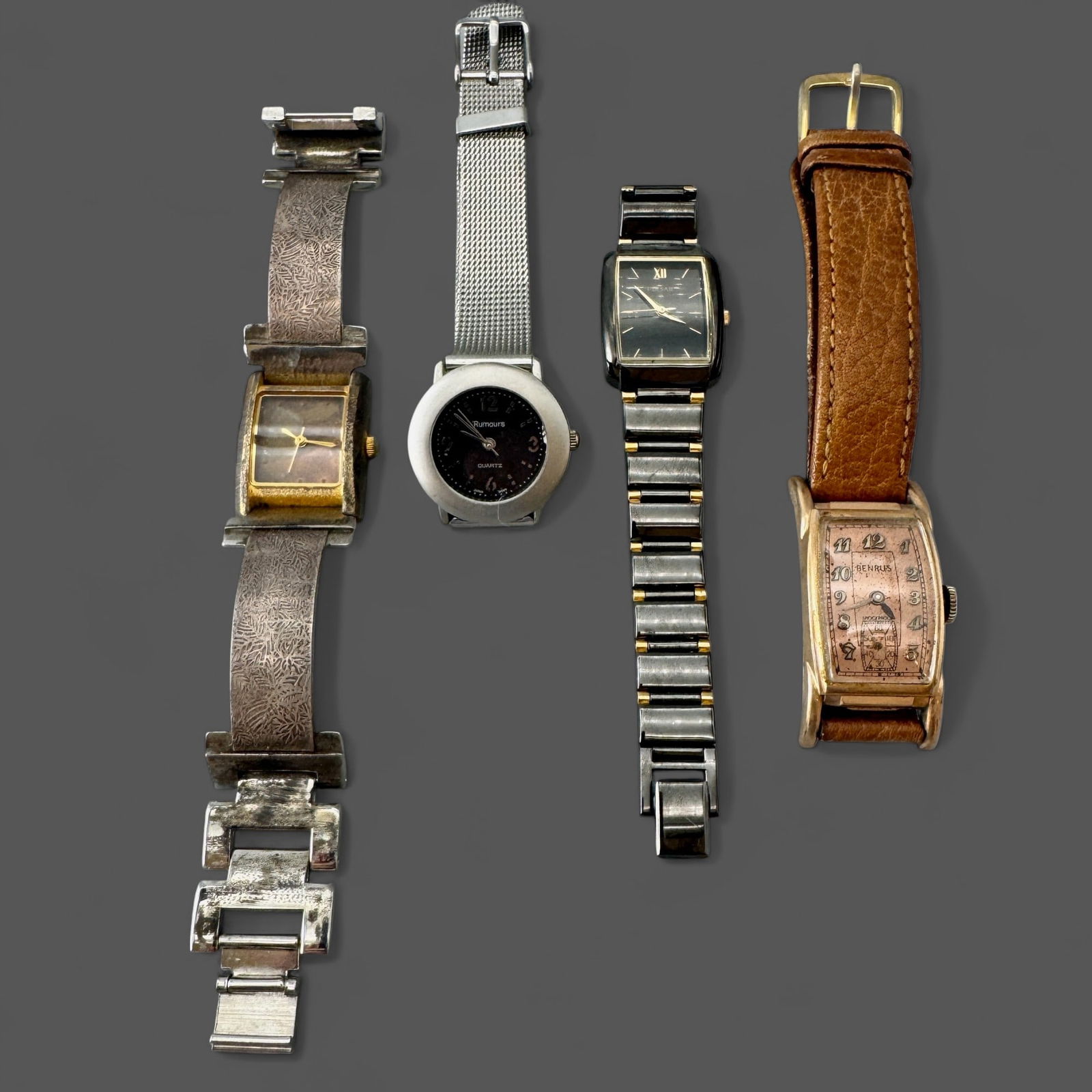 Group of 4 Wristwatches: Examples include a Rumours wristwatch, a Pulsar, a Benrus and one unmarked.