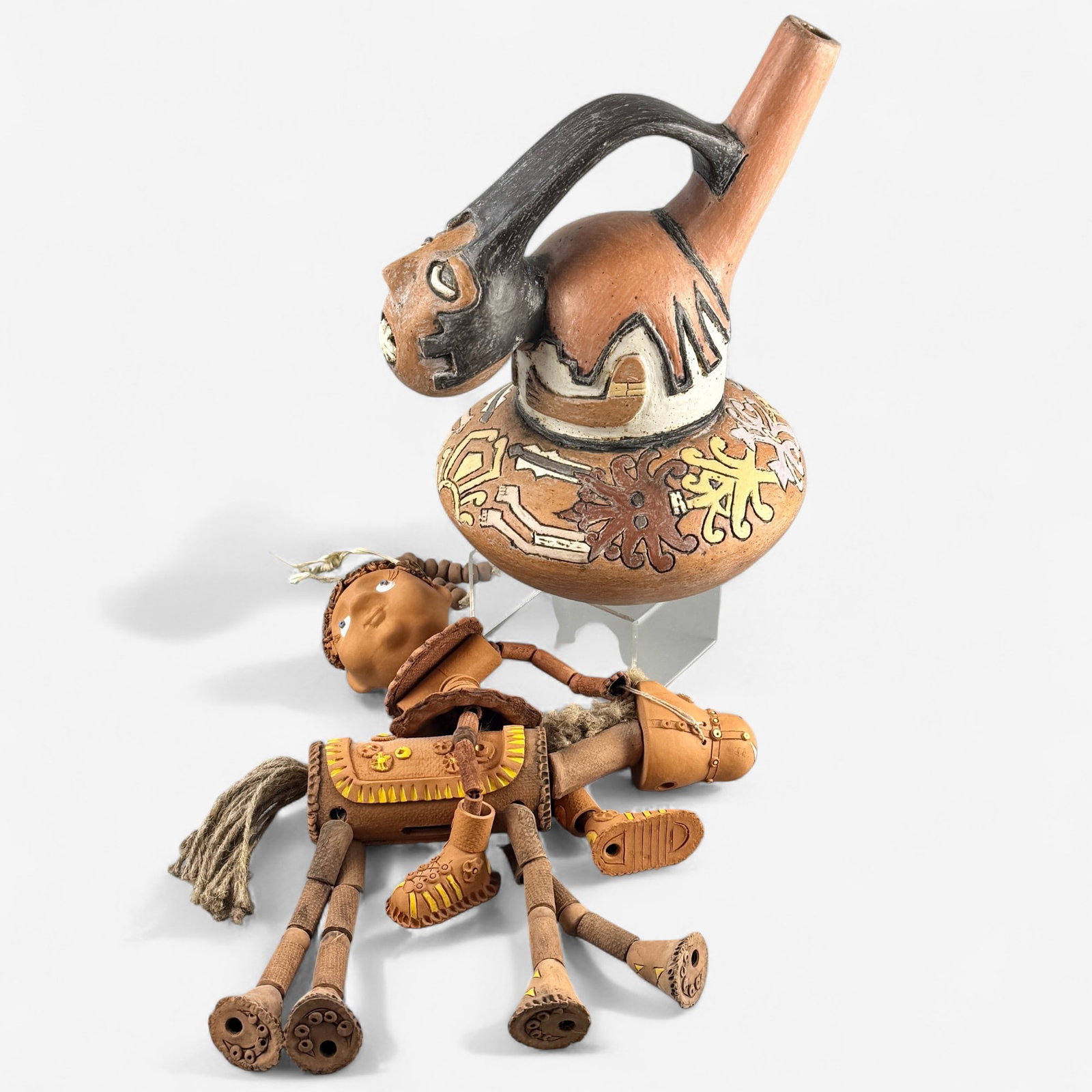 Contemporary Pre-Columbian Style Pottery: Unmarked, depicting a figure of a man with polychrome decoration. Also including a figure atop horseback with various pottery elements strung together. Height of vessel: 10"
