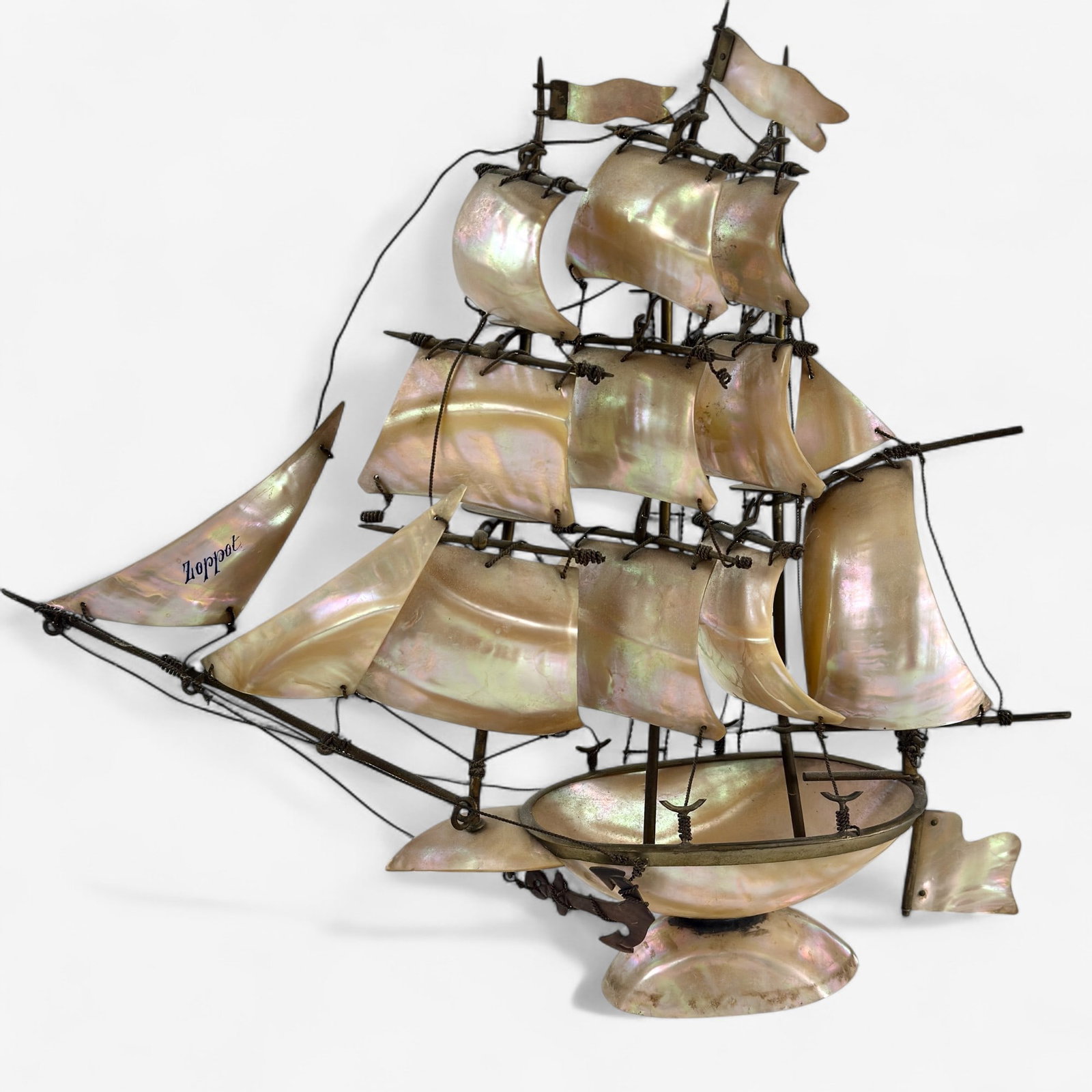 Mother of Pearl Yacht Sailing Ship: Features sails made from mother-of-pearl, handmade; 14" ht. x 15" long