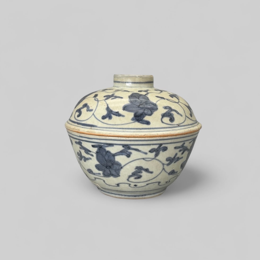 Ming Blue and White Covered Box: Floral decoration to the body, the cover with ring marks to handle, unglazed at the connecting elements. Ht. 5".PROVENANCEPrivate Midwestern Collection, acquired from sources in Southeast Asia, ca. 1