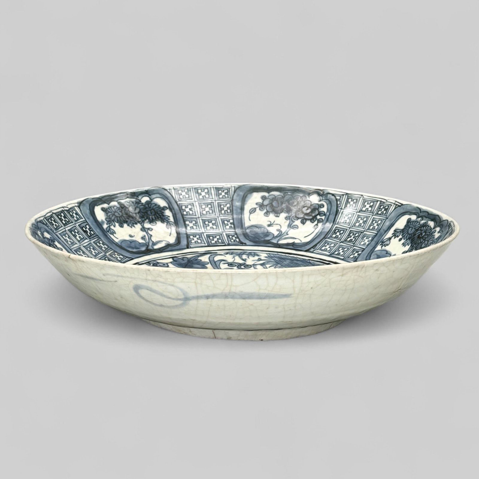 Ming Kraakware Charger: An large ming period Chinese kraakware charger. Fully decorated to interior with crane in center and surrounding florals. Six varying panels depicting fruit trees around the interior rim, and subseque