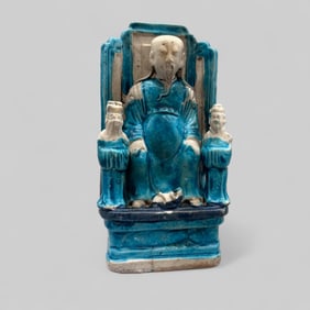 A Chinese Turquoise Glazed Biscuit Figure of Zhenwu
