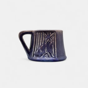 Rookwood "Rabbit" mug in purple mat glaze.