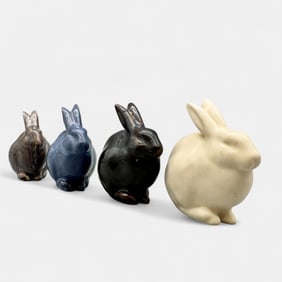 Four Rookwood rabbit paperweights