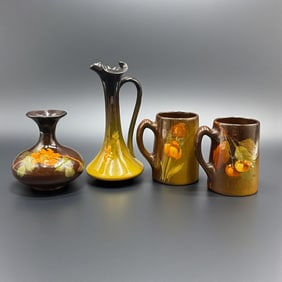 Four Zanesville area brown glaze items. Two Owens, one Weller and one Cambridge item.