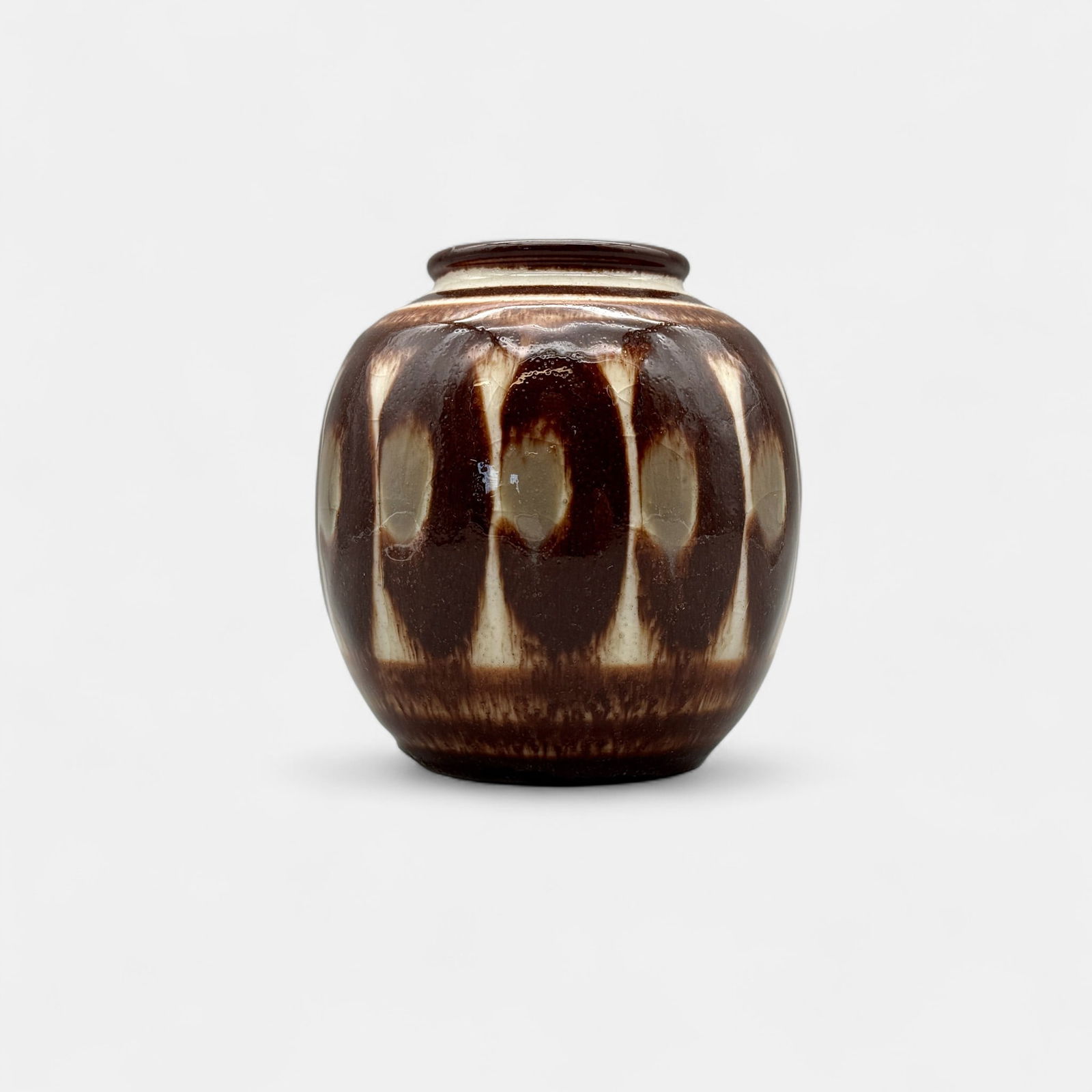 Rookwood Decorated Porcelain, overlapping leaves, Barrett, 1944: Rookwood Decorated Porcelain vase with overlapping, stylized leaves done by Elizabeth Barrett in. 1944. Shape 6183 F, Xed for heavy, chipped glaze at base. Height 4 1/2 inches.