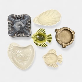 Six Rookwood production trays.