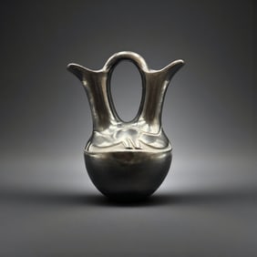 Rose Gonzales, San Ildefonso black on black deeply carved pitcher