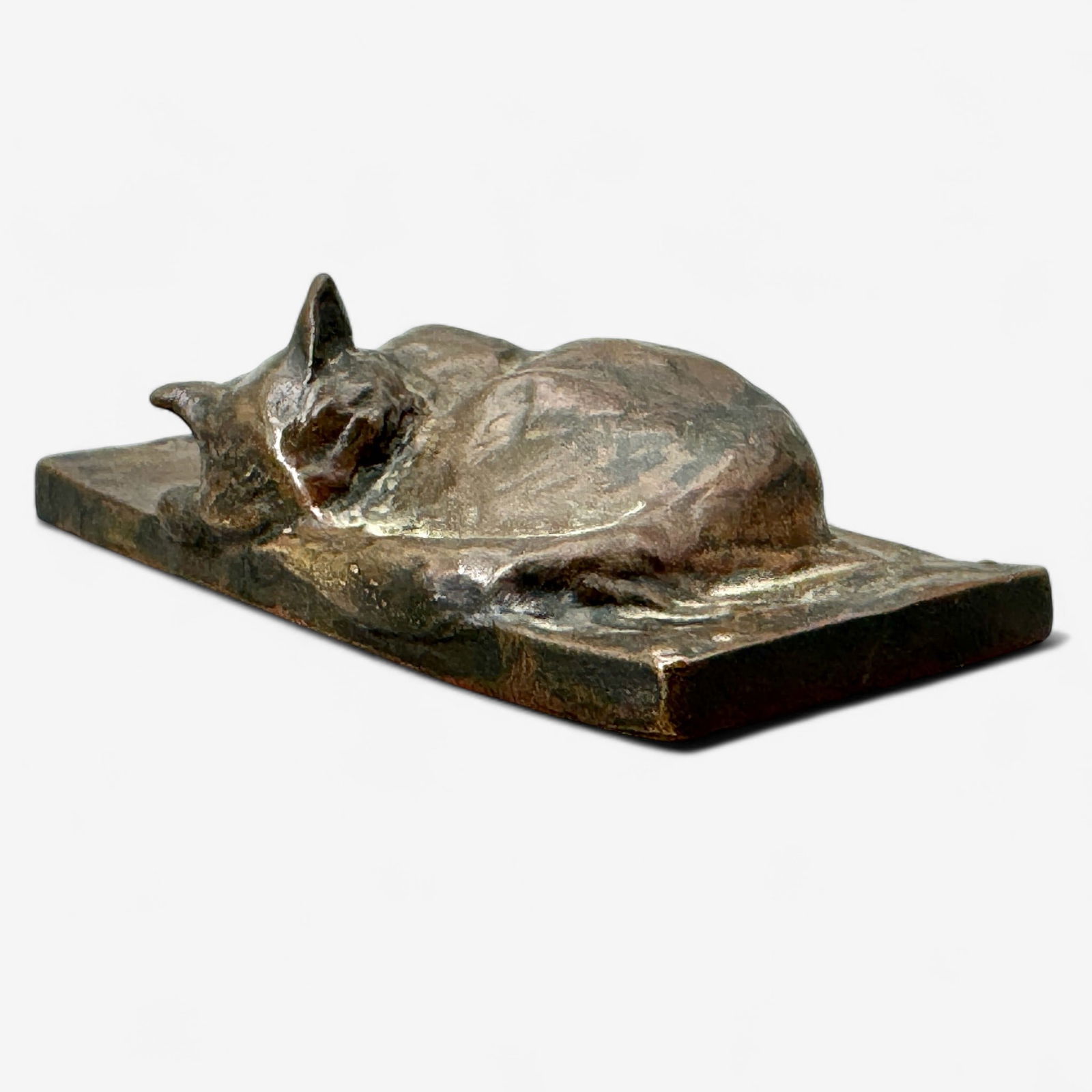 Recumbent Cat Bronze by Theophile Steinlen: Theophile Steinlen (French/Austrian, 1859-1923). A bronze paperweight sculpture of a sleeping, recumbent cat. Signed to base. Lg. 4.5".