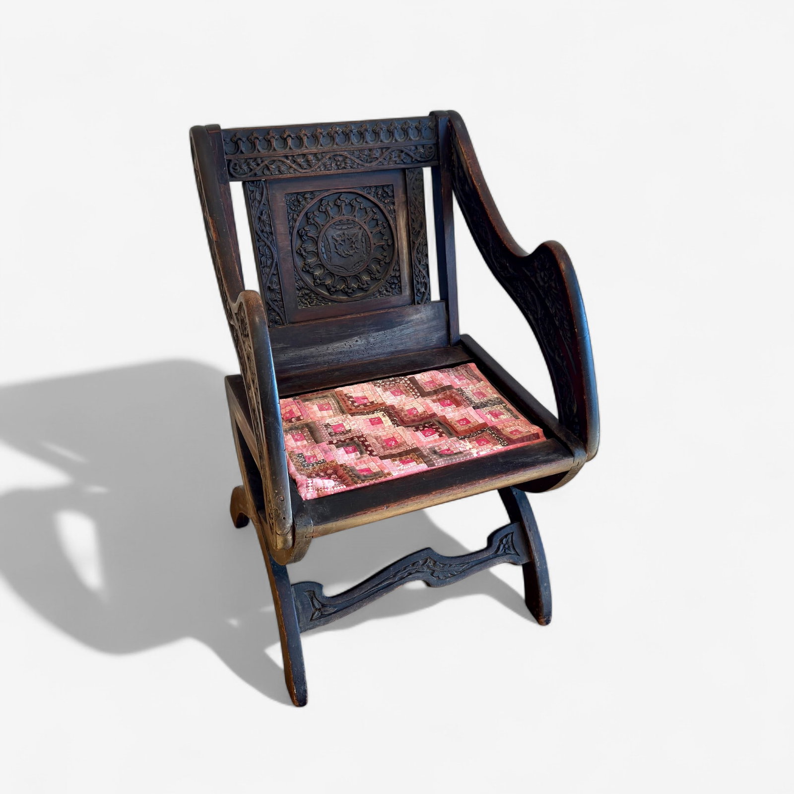 Carved English 19th Century Chair: An elaborately carved armchair, with floral designs. Ht. 37".