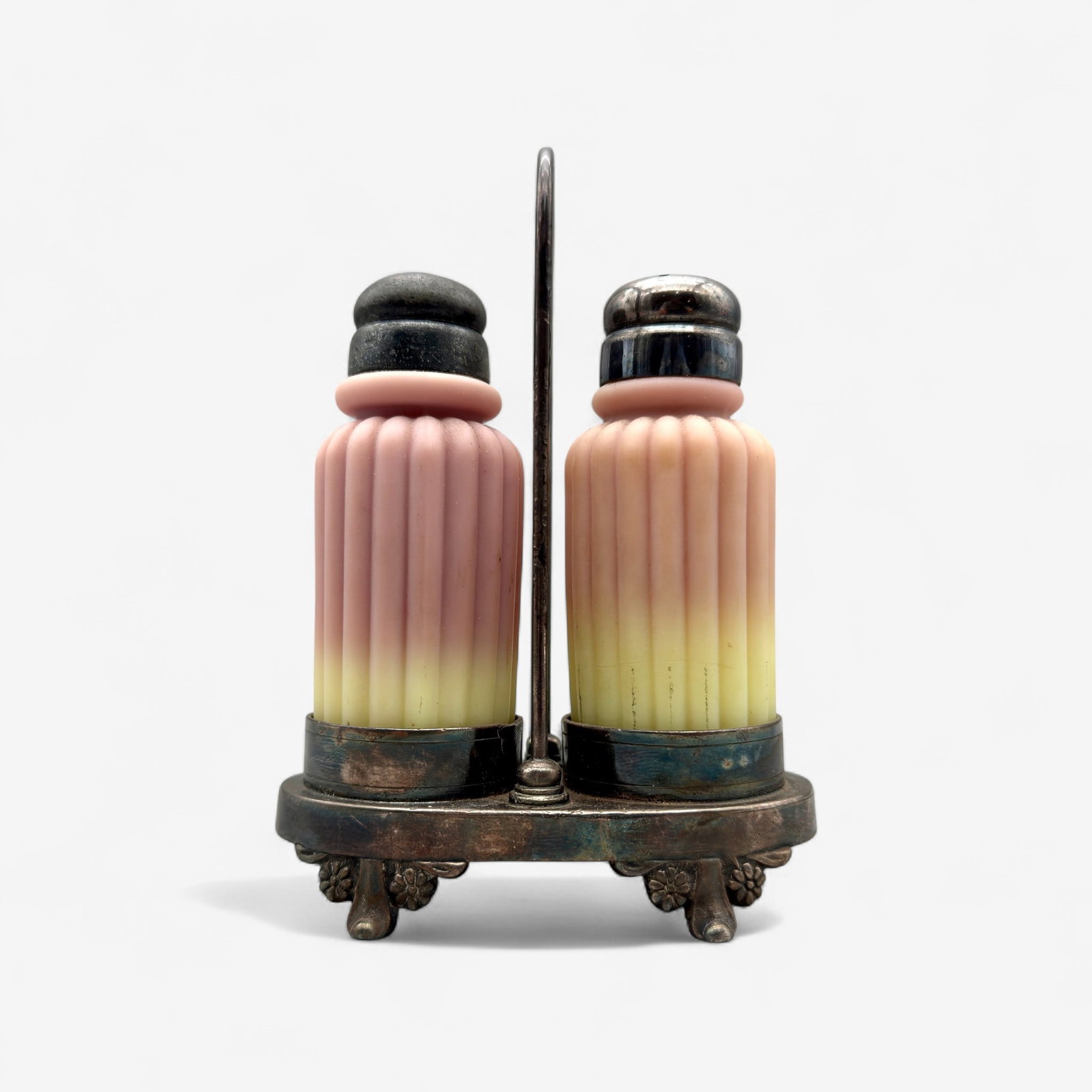 Mt. Washington Burmese Glass Salt and Pepper: Ribbed design and silver plated holder. Ht. 6". Property of a Rockford, Illinois collector