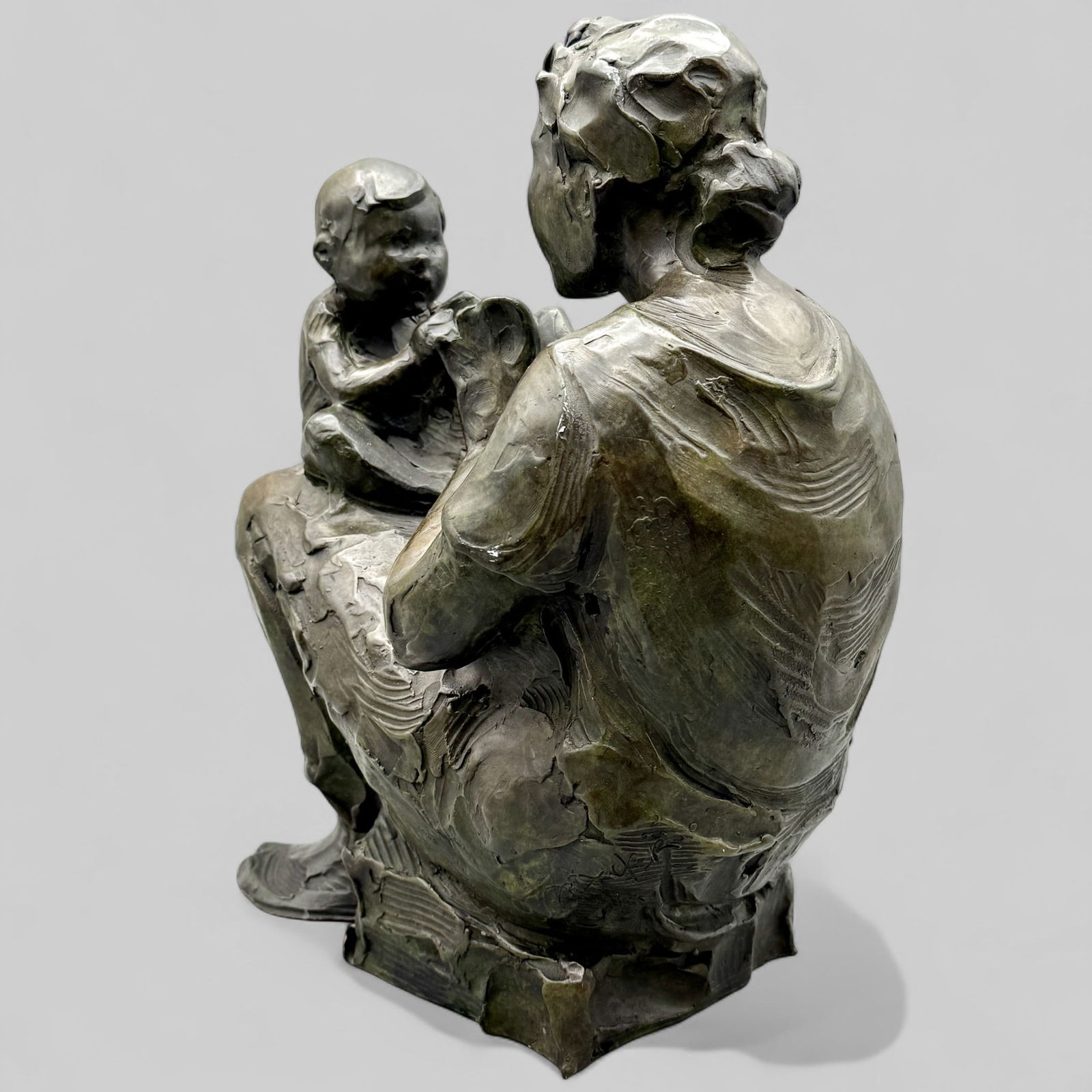 Jane DeDecker (American, b. 1961), Bronze: Signed toward the base and numbered 21/31. Depicting a mother and child. Height: 13.75"