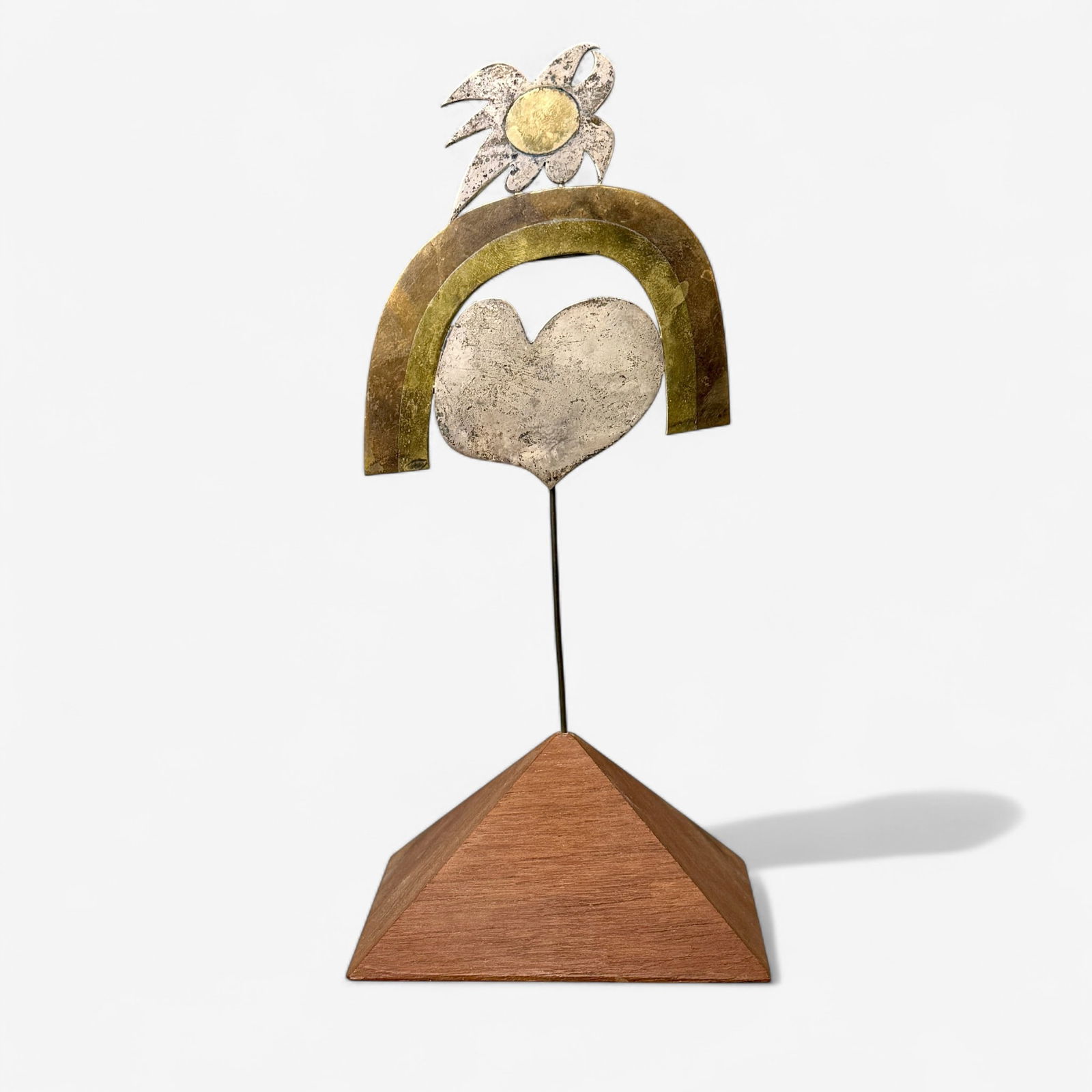 Carol Summers Brooch on Stand: Carol Summers (American/New York, 1925-2016). A mixed metal brooch, signed and numbered to verso, all on a triangular wood stand, but the brooch separates and has a pin back. Brooch size 4.25" ht., 3.