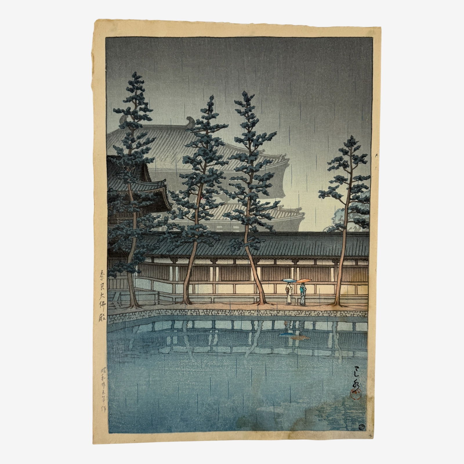 "Nara Daibutsuden" Woodblock by Hasui Kawase: Hasui Kawase (Japanese, 1883-1957). Woodblock in colors, artist seal l.r. in impression, Watanabe seal l.r. corner, and impressed marks to left margin. Unframed. 15.25" x 10.25" (full sheet).