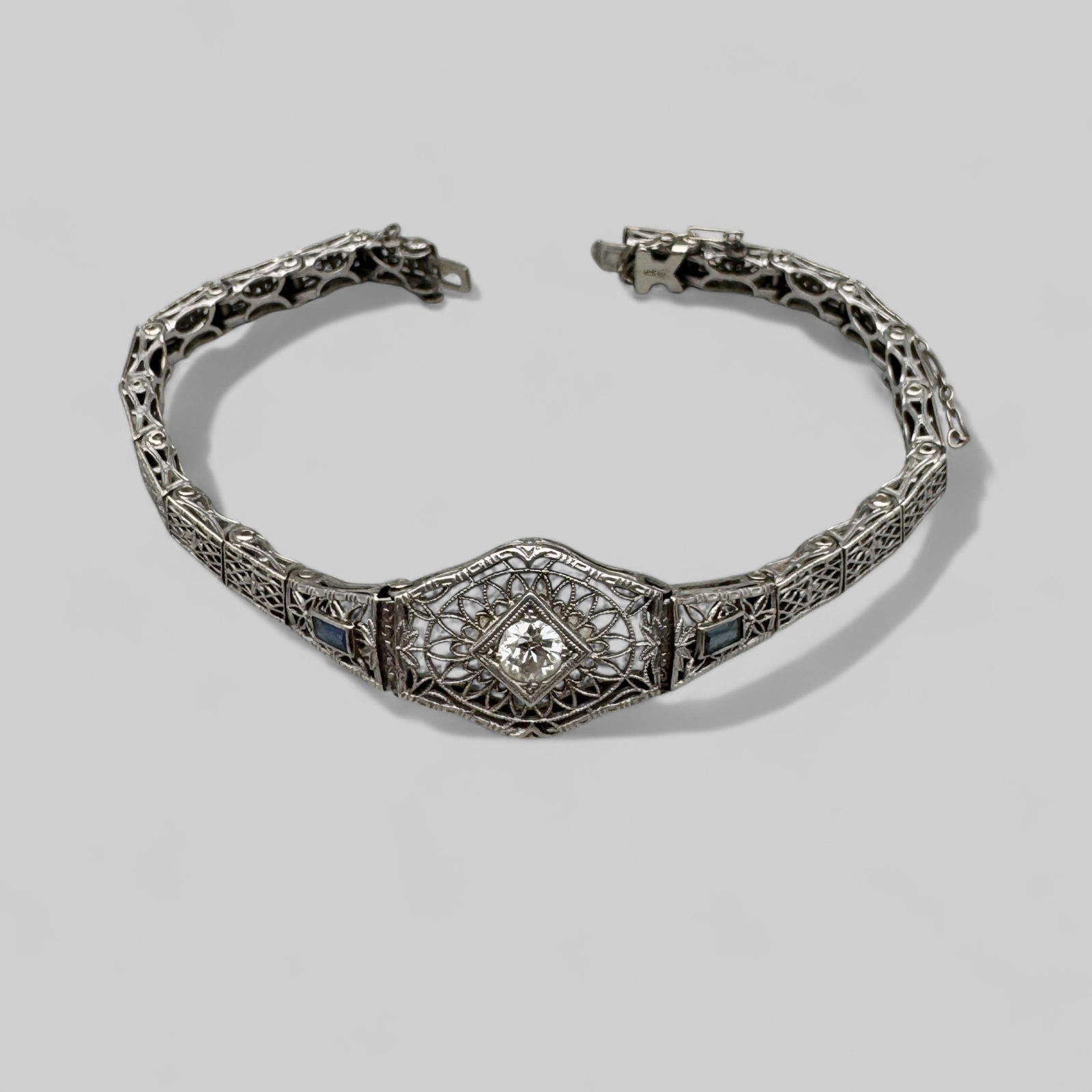 Art Deco Filigree 14k Bracelet with Diamond: Weighing 9.1 grams, a few sapphire stones and central diamond.