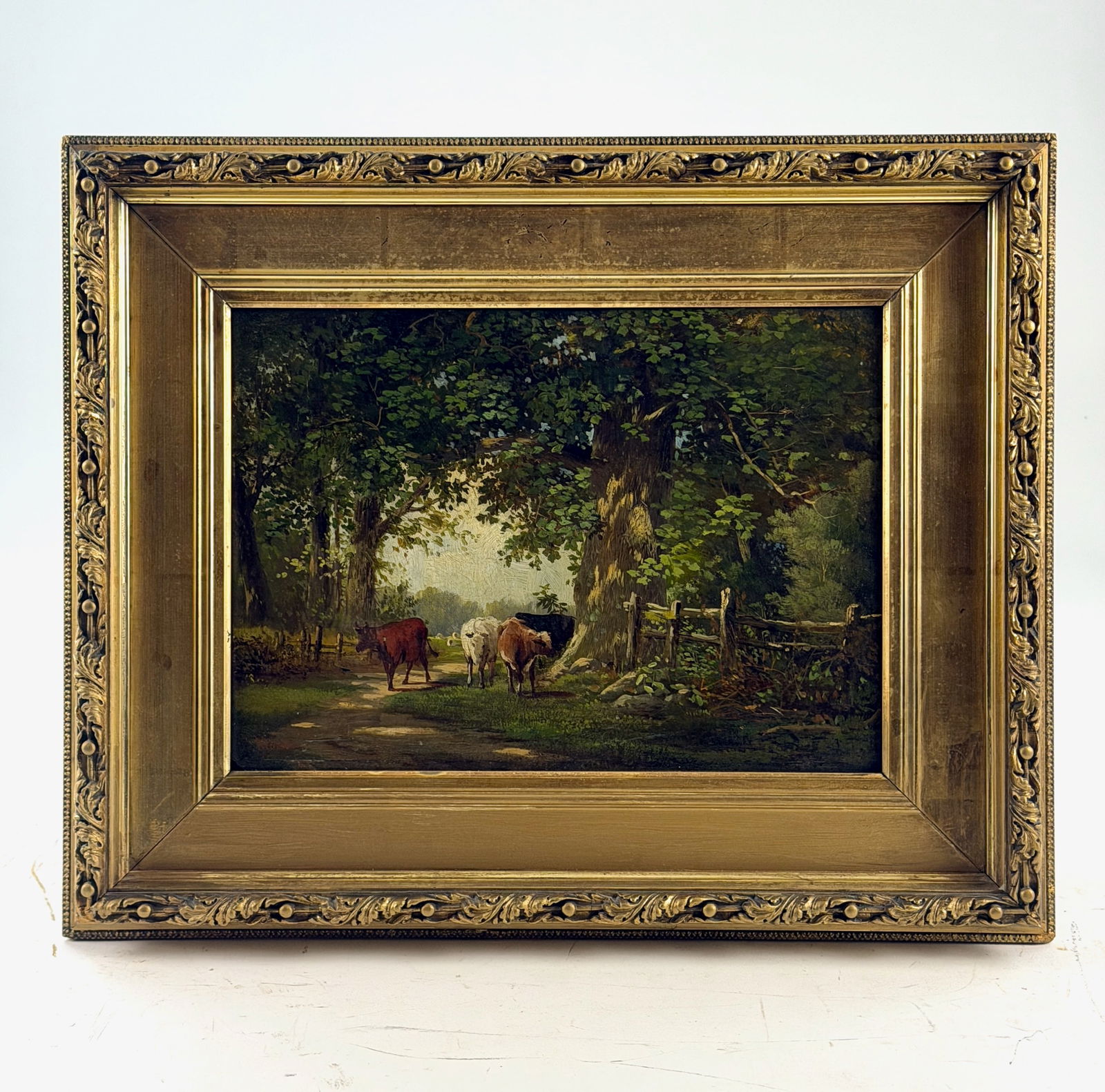 Edward Moran Pastoral Landscape: Edward Moran (American, 1829-1901). Oil on board, 19th century, an early landscape for the painter, signed l.l. Housed in period gilt frame, with semblances of an equestrian subject to verso board. 8.