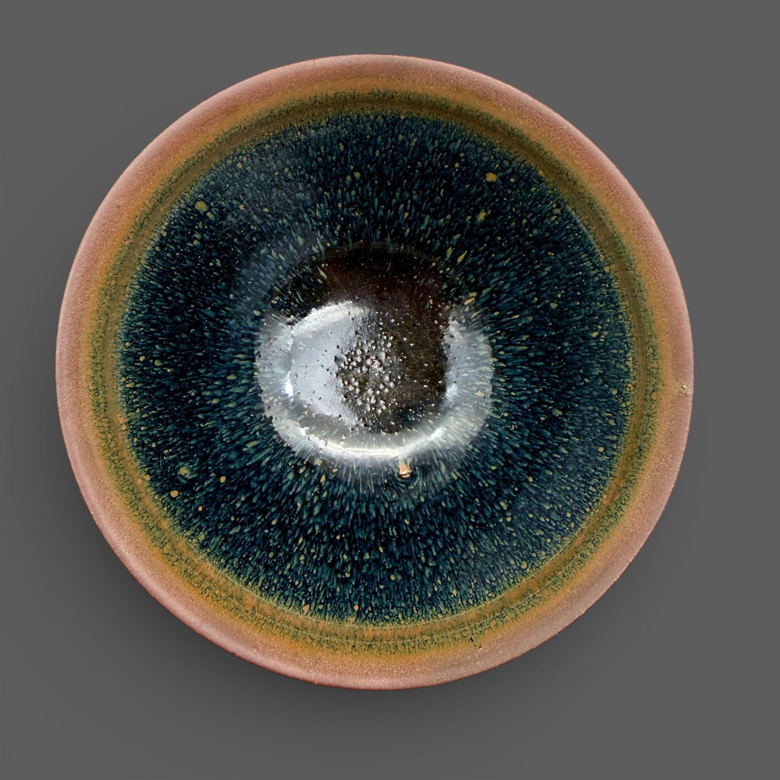 A Jian "Hares Fur" Bowl: Southern Song dynasty. "Hares fur" tea bowl with drip glaze extending downward resulting in two extremely large glaze drips which extend down toward foot. Diameter: 4.75" PROVENANCE<