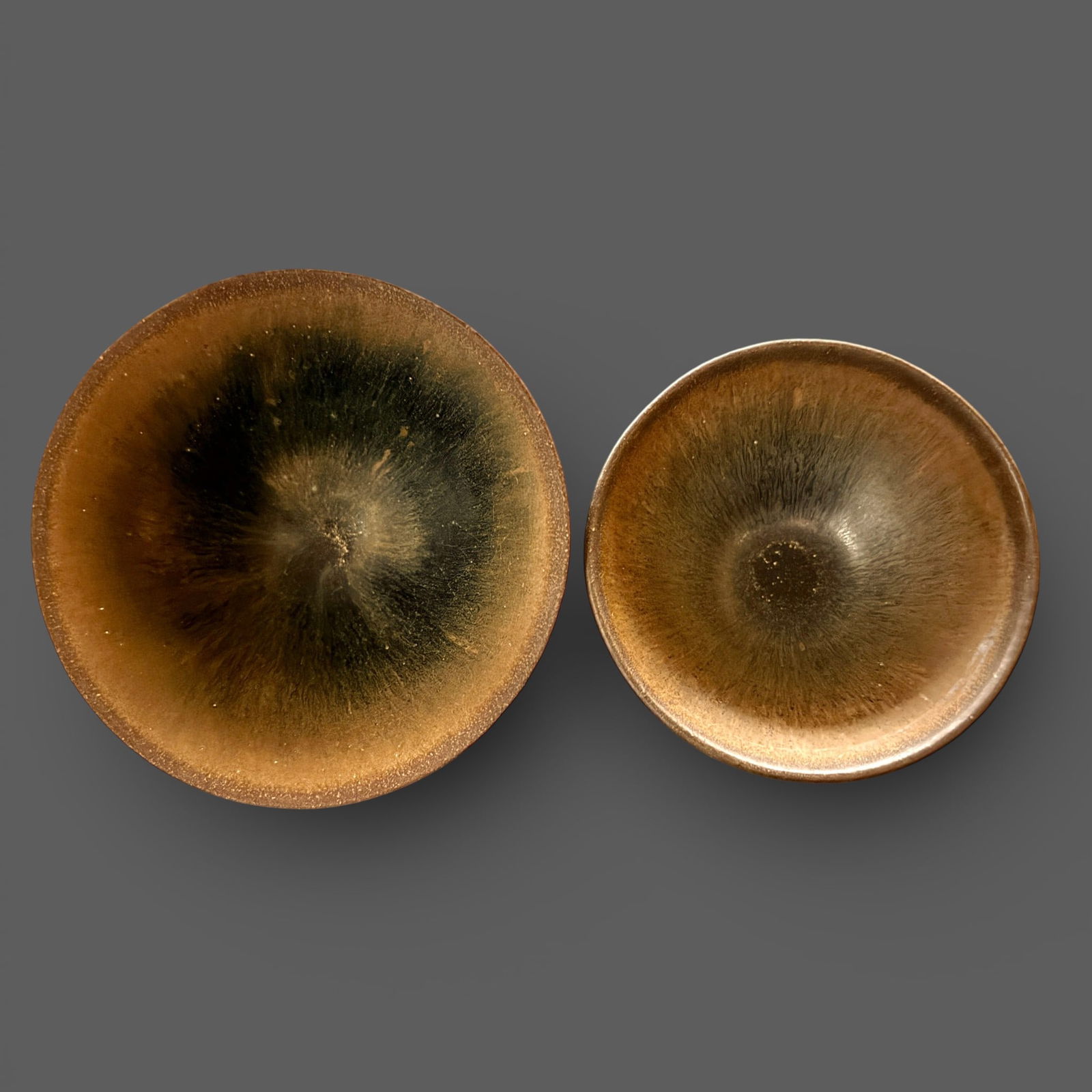 A Pair of Jian "Hares Fur" Bowls: Southern Song dynasty. Two smaller "Hares fur" bowls, in loose form noe with flared rim. Both with similar thick glaze. Diameter of each: 3.5" and 4 1/8" PROVENANCE Priv