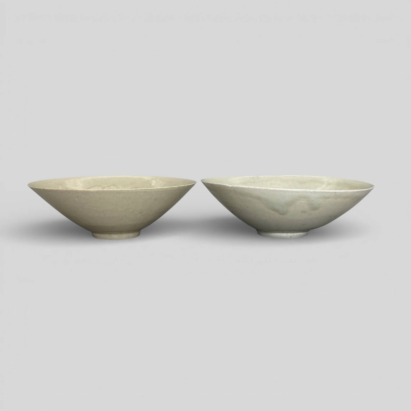 Pair of Incised Celadon \"Cloud Bowls\"