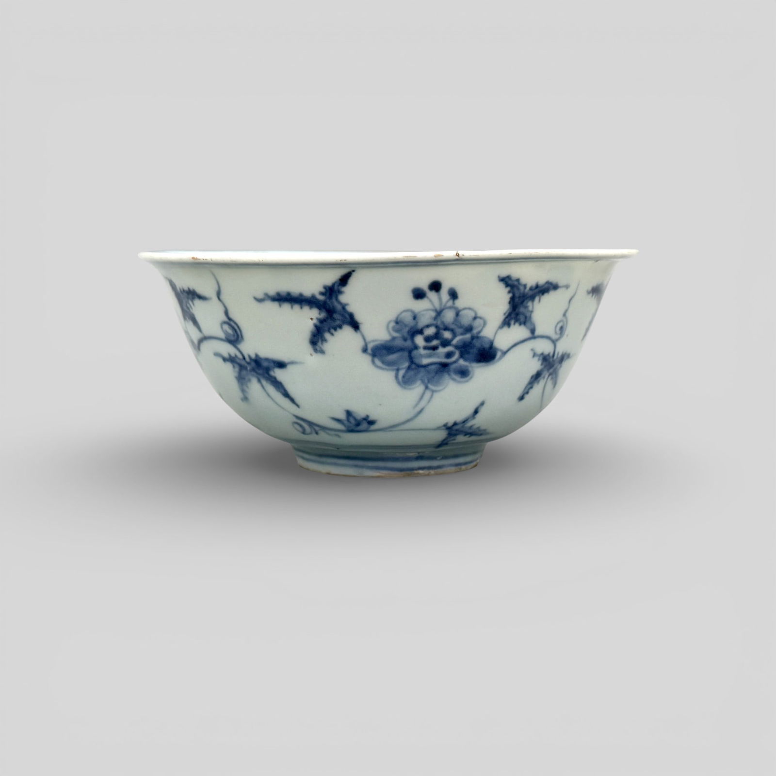 Ming Period Blue and White Bowl: Ming period, a blue and white bowl with more spaced, harmonious decoration to the body and interior, sets of double rings at rim and foot. Ht. 2.5", diameter 5.75". PROVENANCE
