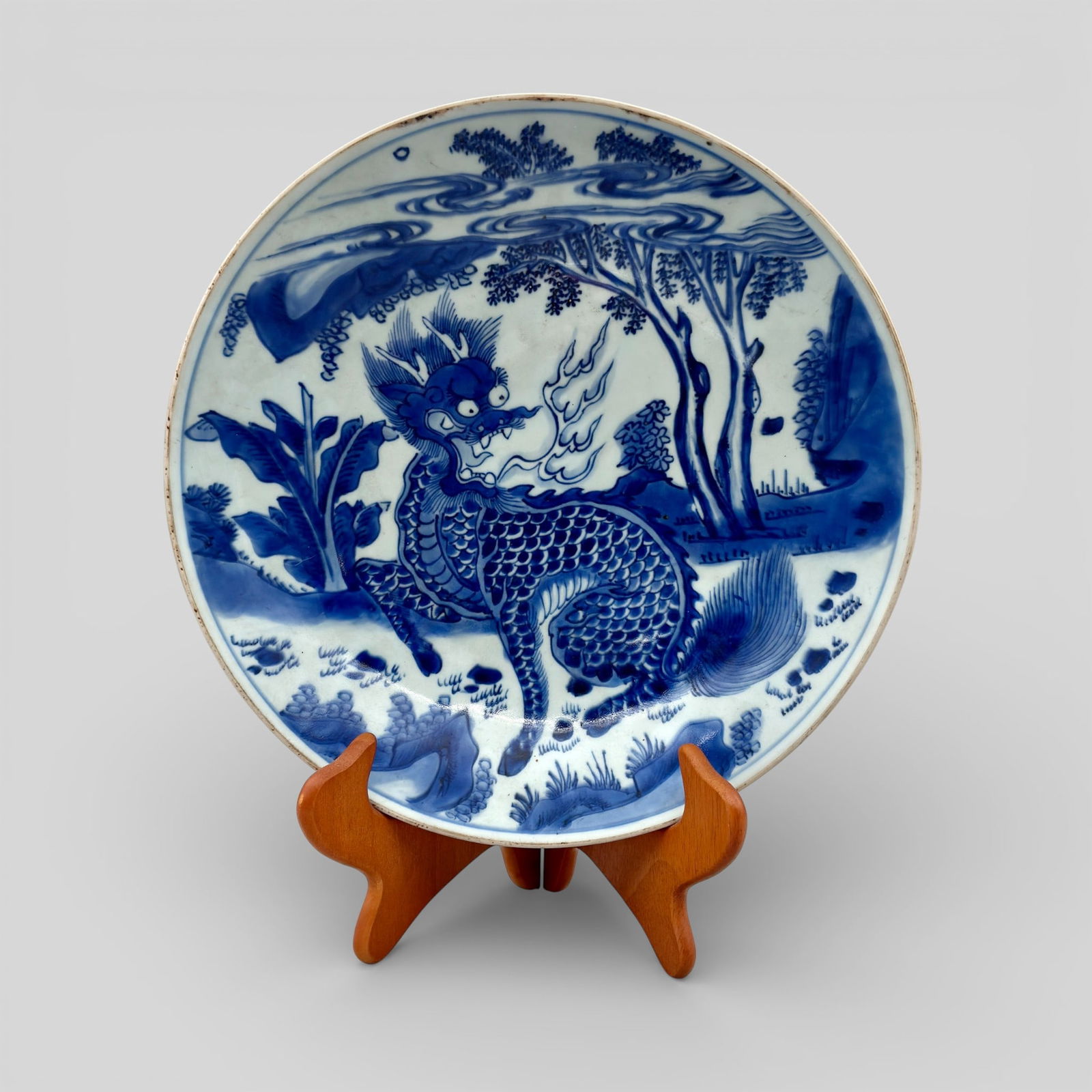 Transitional Qilin Charger in Blue and White: Transitional period. A blue and white "qilin" charger, underside with double ring and single mark to underside. Diameter 12.5". PROVENANCE Private Collection, Columbus O