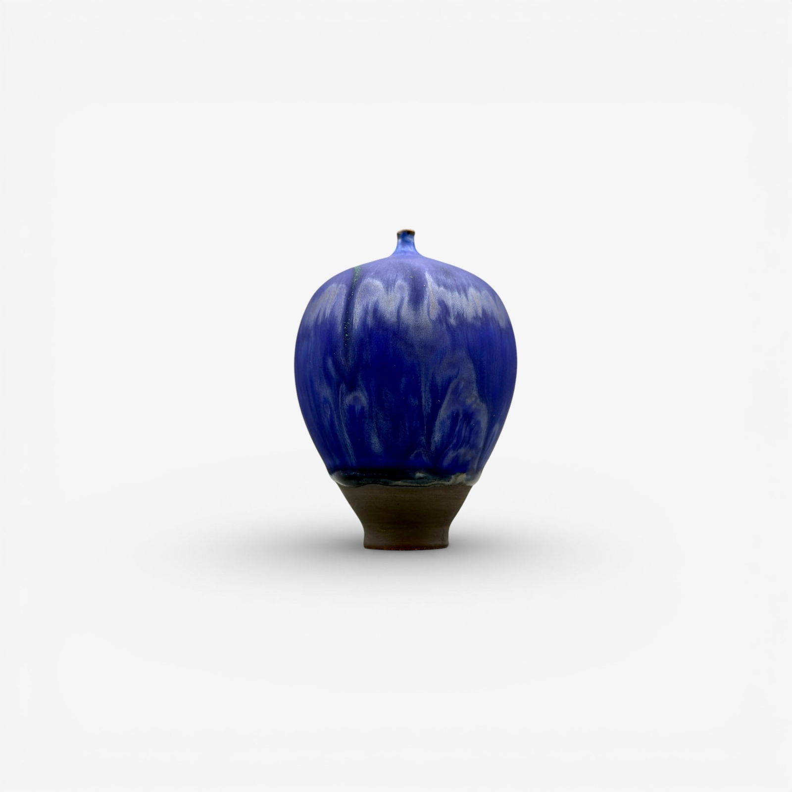 Rose and Erni Cabat "Feelie." mottled purple: Rose and Ereni Cabat Feelie in purple over gray. Incised "Cabat." Height 3 7/8 inches.