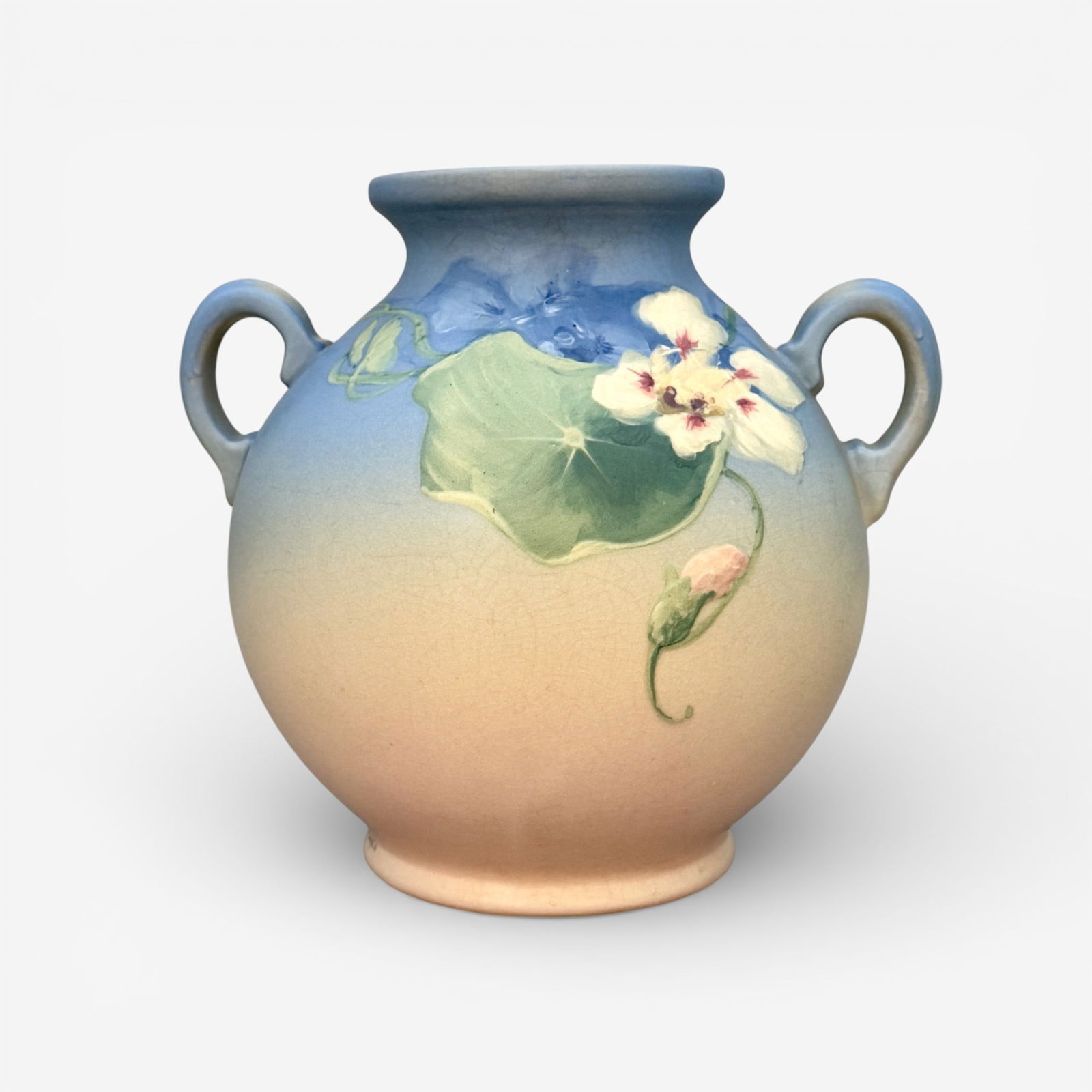 Weller Hudson vase, Nasturtium, McLaughlin: Colorful Weller Hudson twin handled vase with nasturtium leaves, stems and flowers done by Sarah McLaughlin whose signature appears near the foot rim on the outside. Incised Weller Pottery on the unde