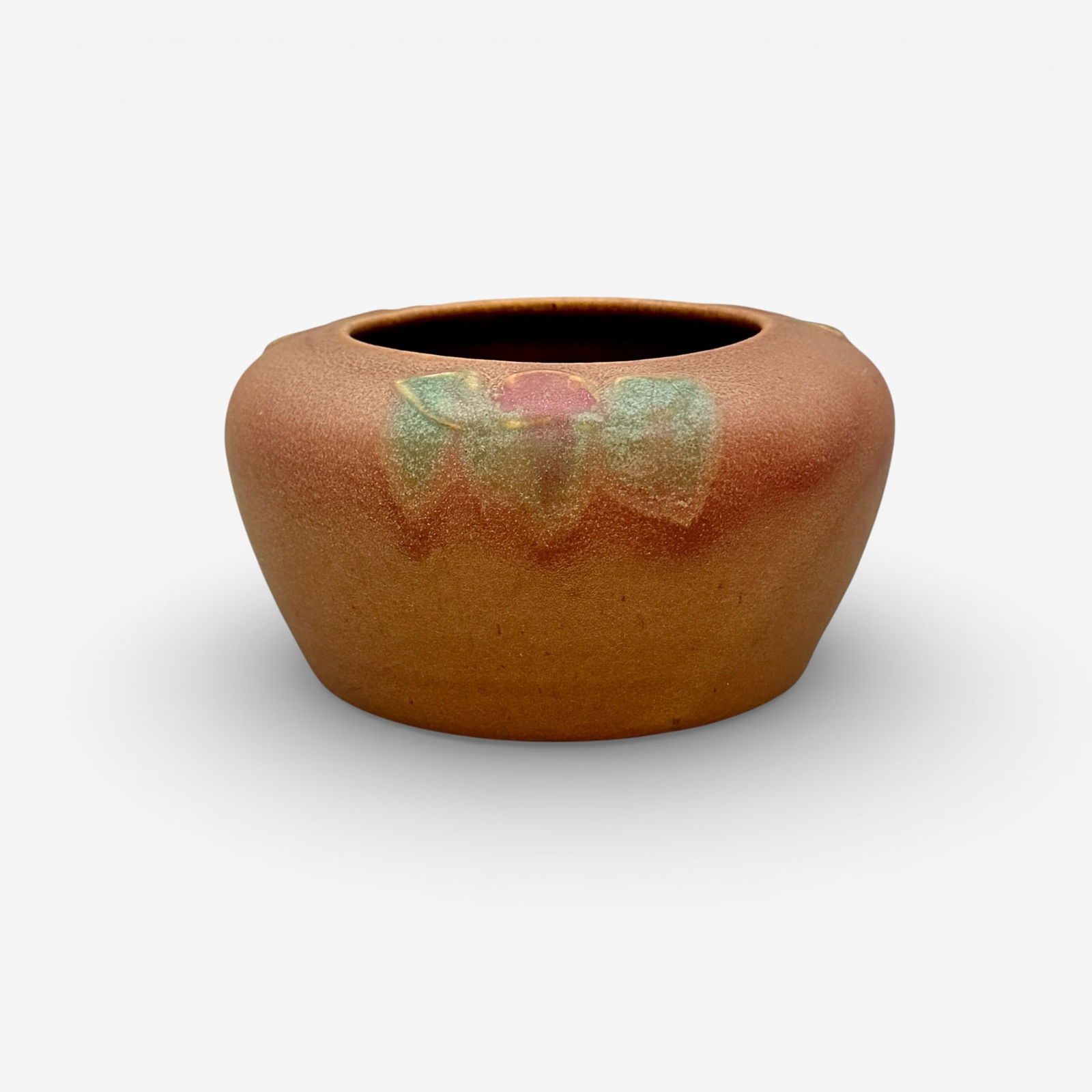 Rookwood bowl with red and green carved flowers, Duell, 1909: Carved Rookwood bowl with simple red and green flowers on a brown ground, the work of Cecil Duell in 1909. Impressed marks include Rookwood logo, IX, Shape number 967, a triangle esoteric mark. Incise