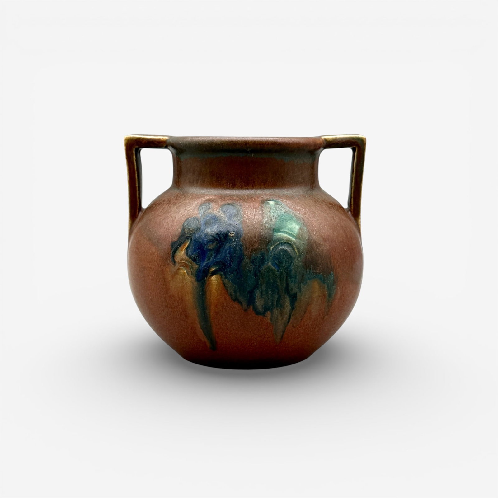 Twin handled Decorated Mat floral, Todd, 1914: C.S.Todd Rookwood Decorated mat twin handled vase with carved and painted flowers on opposing sides. Impressed Rookwood logo, XIV, Shape number 2079. Incised CST. Height 4 5/8 inches.