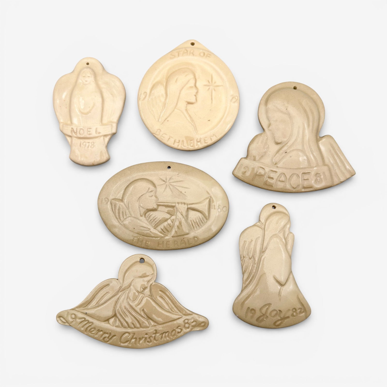 Set of six Van Briggle Christmas ornaments, 1978-1983.: Set of six Van Briggle Christmas Ornaments. Various shapes and dates, each a number out of 1000 produced. All ornament sized. Each tan in color under high glaze.