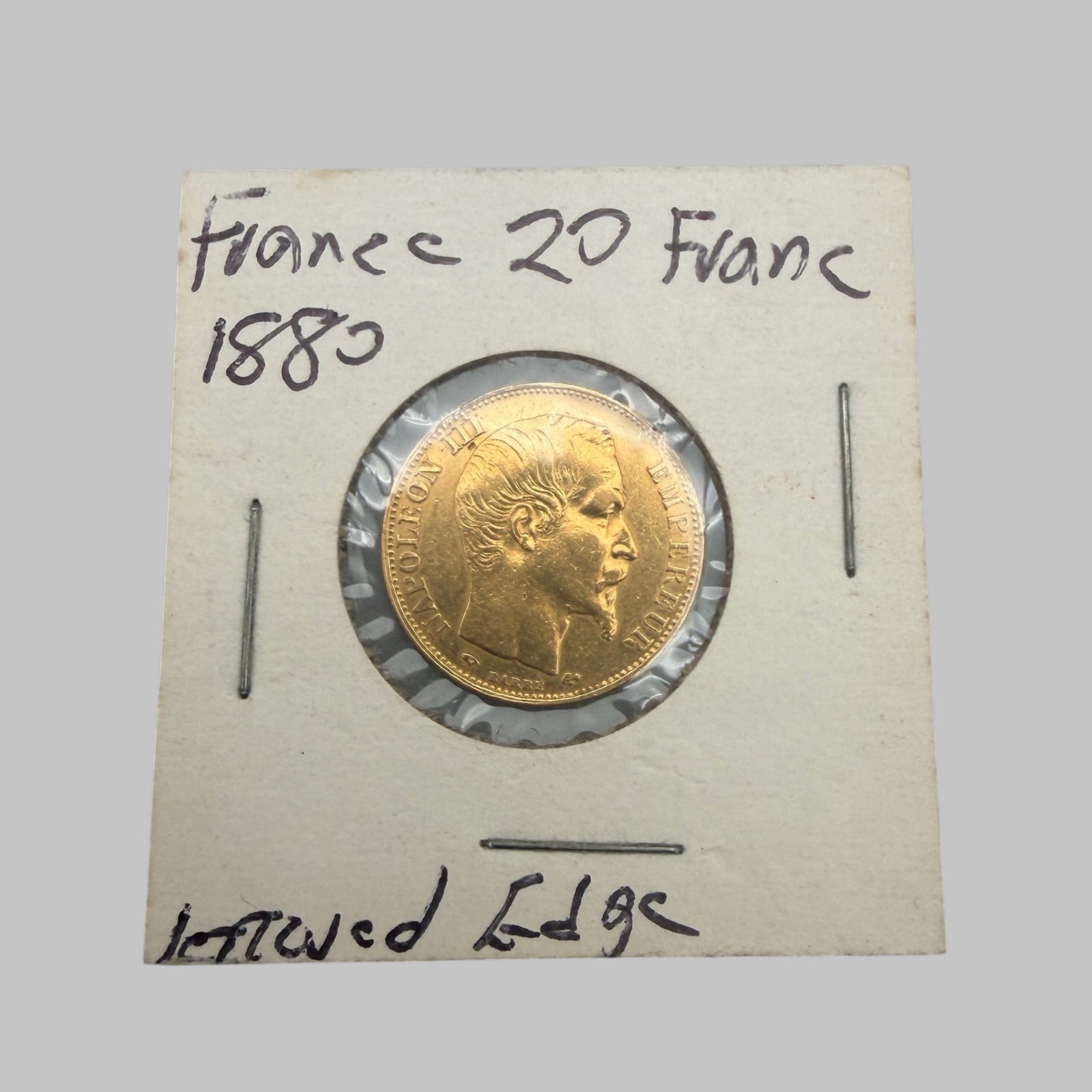 France Five Franc Gold Coin: Napoleon III, dated 1880. Slight edge ding, else VG.