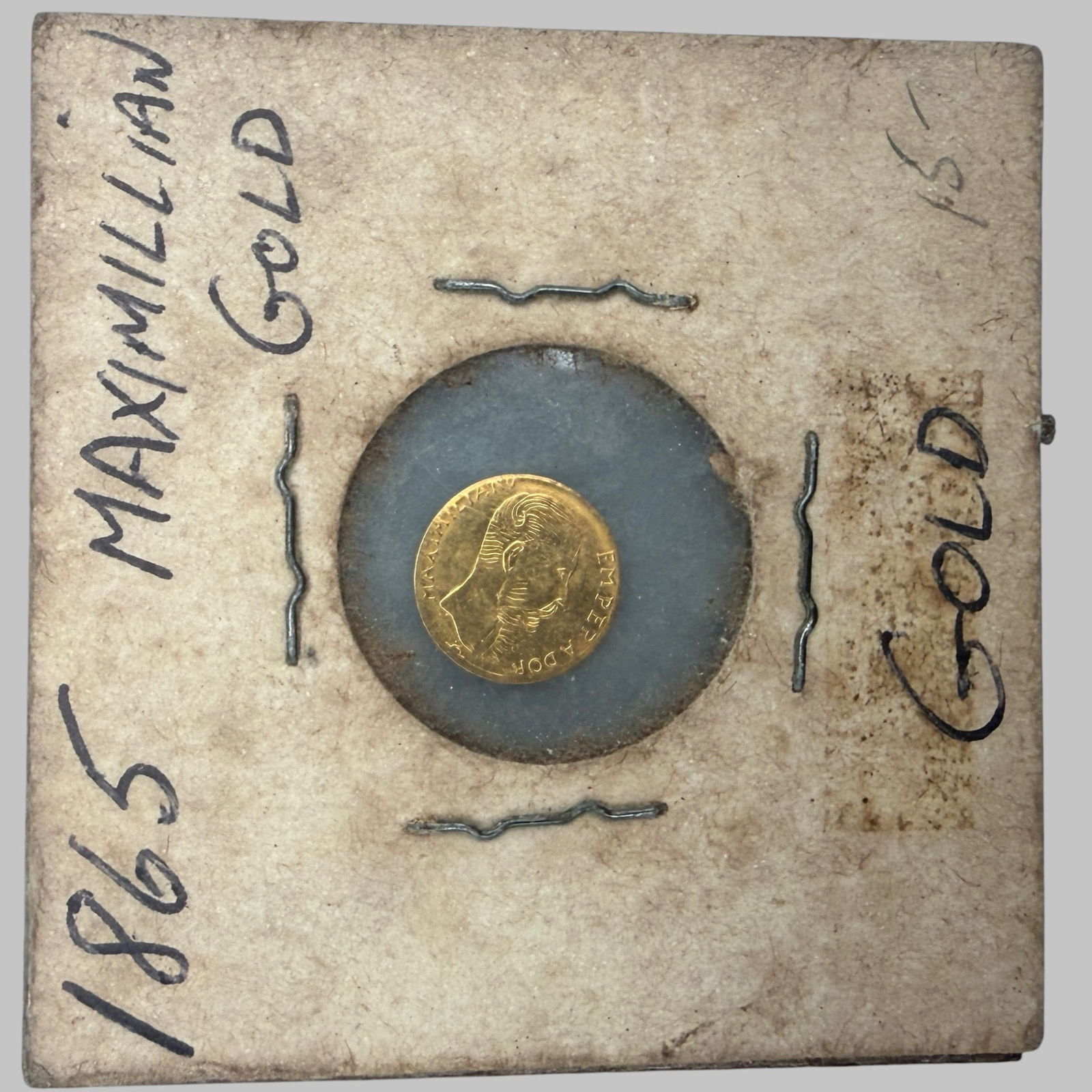 Mexico Maximilian One Peso Gold: Dated 1865. Condition Fine.